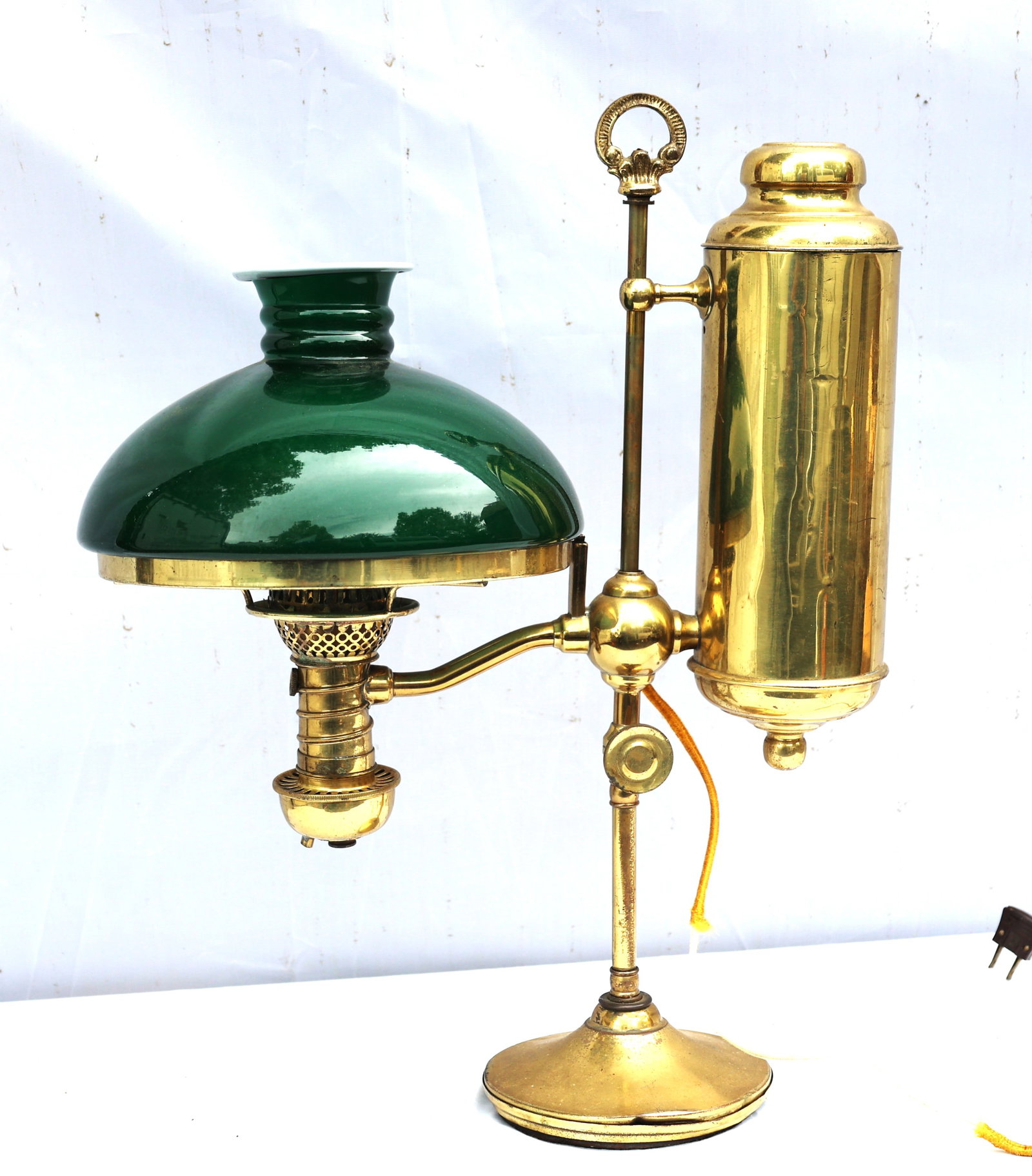 Victorian-style desk lamp is an antique brass student lamp featuring a characteristic emerald green (1 of 3)