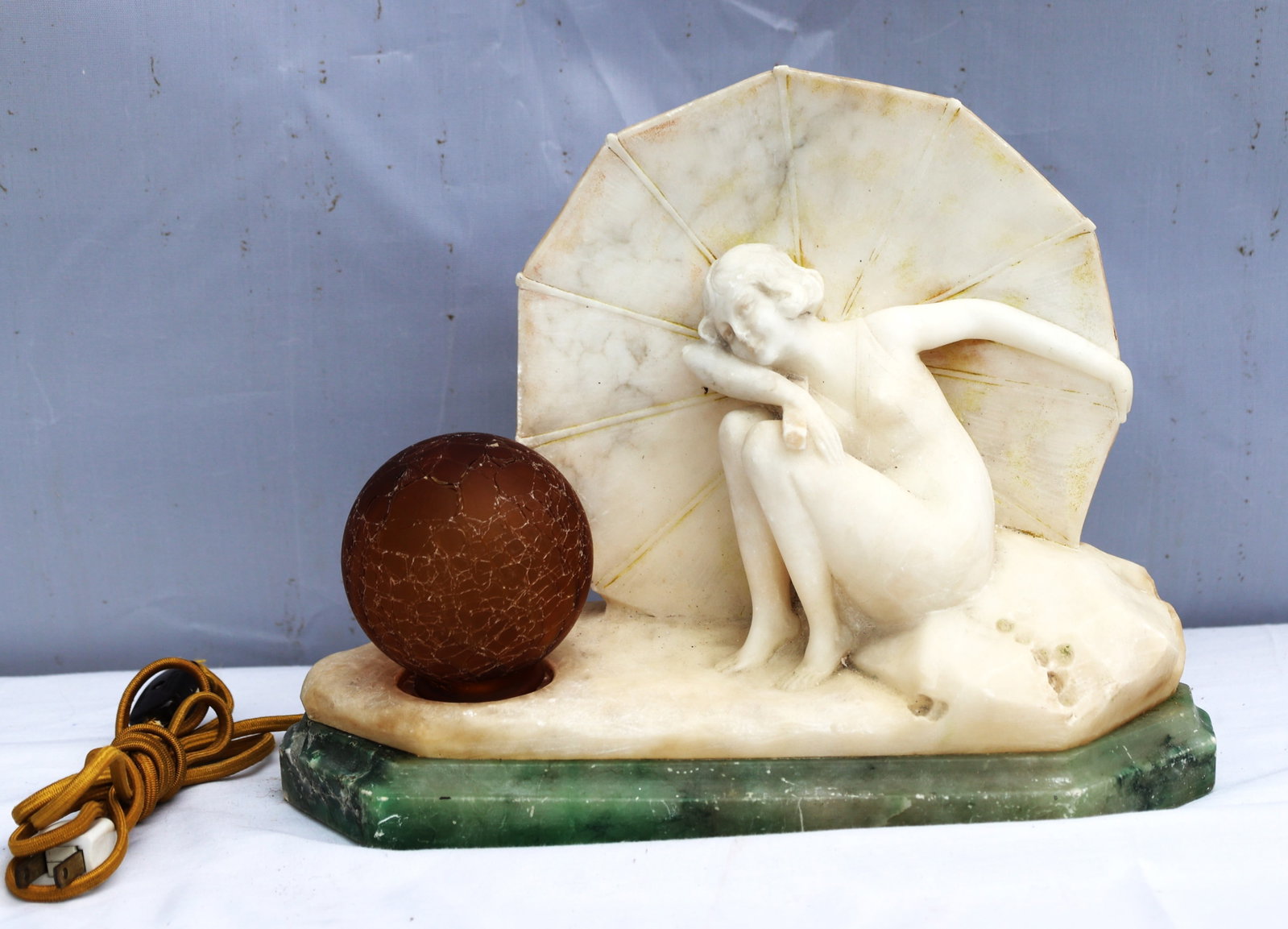 vintage Art Deco lamp features a hand-carved alabaster figure reclining against an umbrella-shaped s (1 of 7)