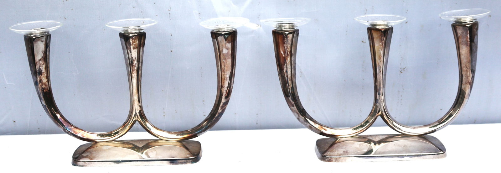pair of vintage WMF silver-plated candelabras in an Art Deco design: Size: 7 in. height, 12 in. length, 3 in. wide; pair of vintage WMF silver-plated candelabras in an Art Deco design