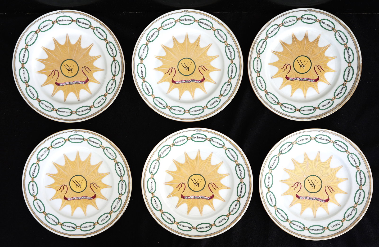Set 6 vintage reproduction of a "Martha Washington States Plate" manufactured by Haviland Limoges o: Size: 9 5/8 inches diameter; Set 6 vintage reproduction of a "Martha Washington States Plate" manufactured by Haviland Limoges of France.Design: Features a central gold sunburst with the initials "MW"