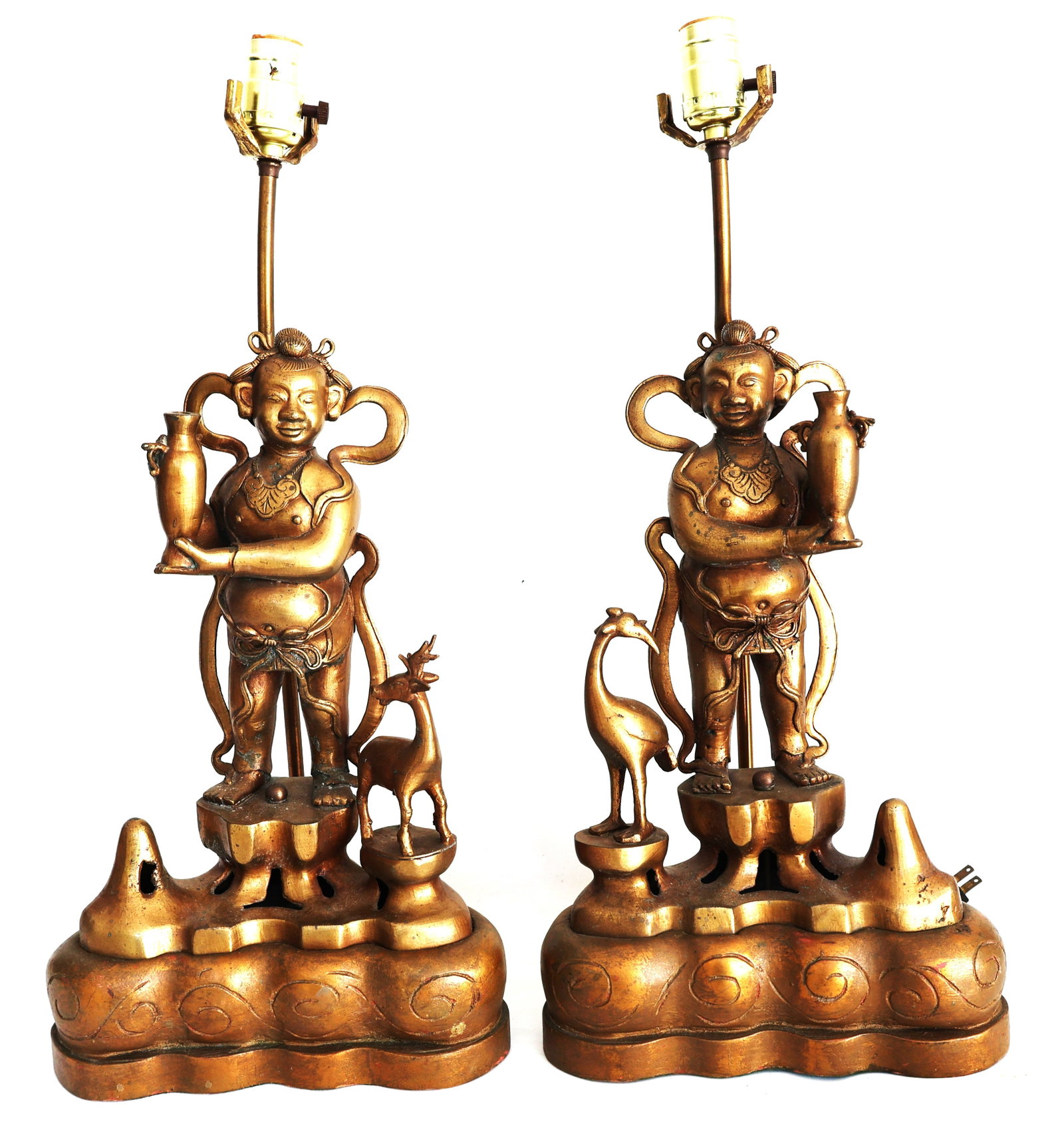 pair of vintage Tibetan Buddhism-inspiredbronzer gilt lamps featuring "Sudhana" (Child of Wealth) sc: Size: 21 1/2 in. height, 15 in. height of figure, 9 1/2 inches wide. ; pair of vintage Tibetan Buddhism-inspired bronze gilt lamps featuring "Sudhana" (Child of Wealth) sculptures