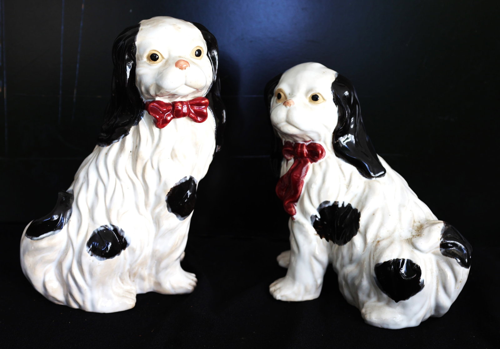 vintage-style porcelain Staffordshire spaniel dog statues featuring a black and white design with pr (1 of 5)