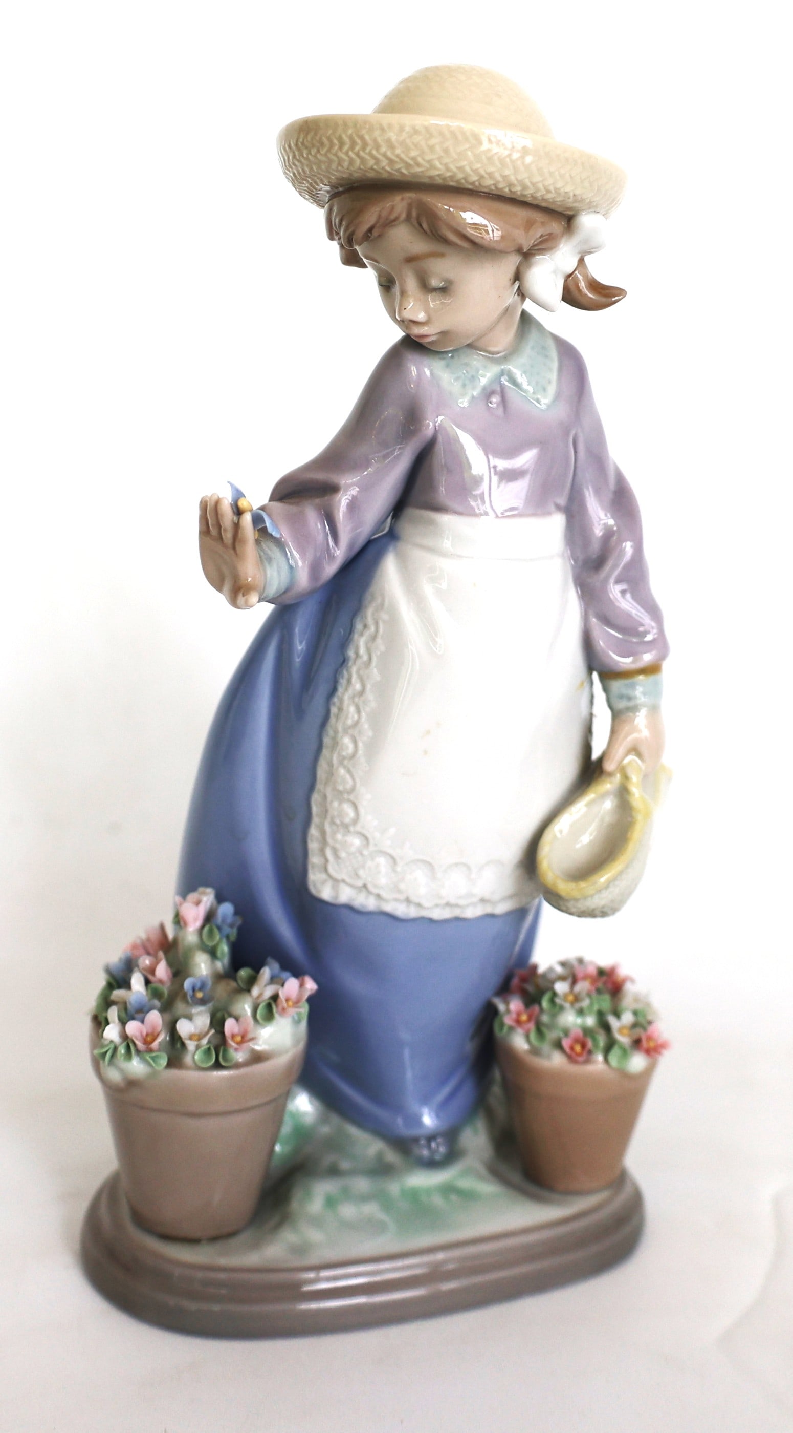 Lladró Spanish porcelain figurine titled "Hello, Flowers".It is identified by model number 5543 and (1 of 6)