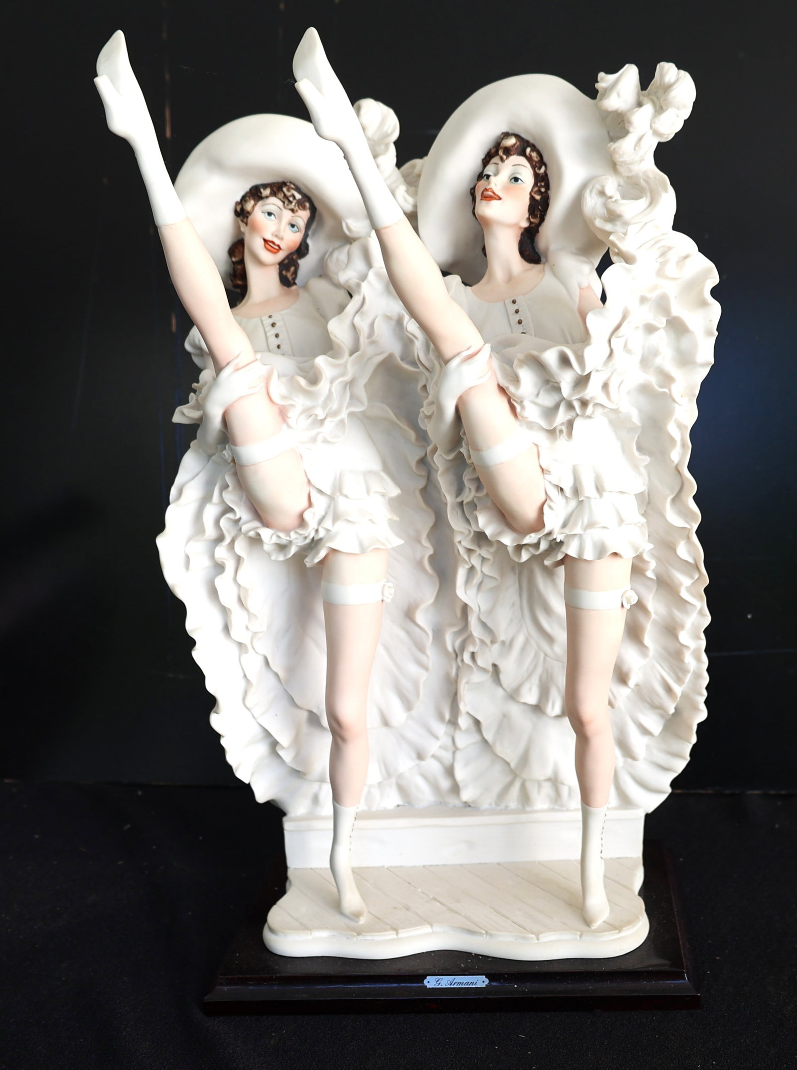 Giuseppe Armani Florence sculpture features two dancers in white outfits performing a high-leg kick (1 of 9)