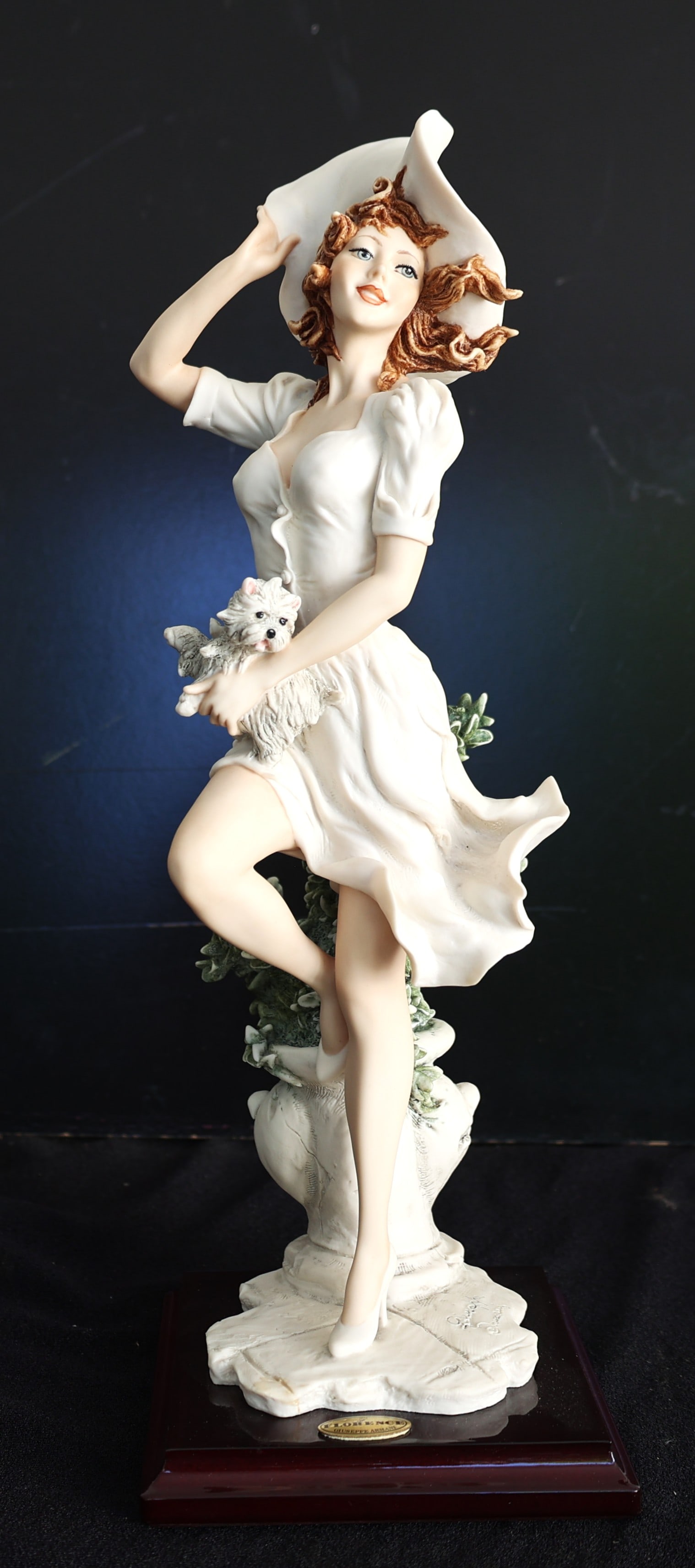 Autumn-Falling Leaves by Giuseppe Armani is collectible fine art inspired by the Giuseppe Armani tra: Size: 15 in. height, 5 1/4 in. x 5 1/4 in. baseAutumn-Falling Leaves by Giuseppe Armani is collectible fine art inspired by the Giuseppe Armani tradition of elegant porcelain figurines, with box