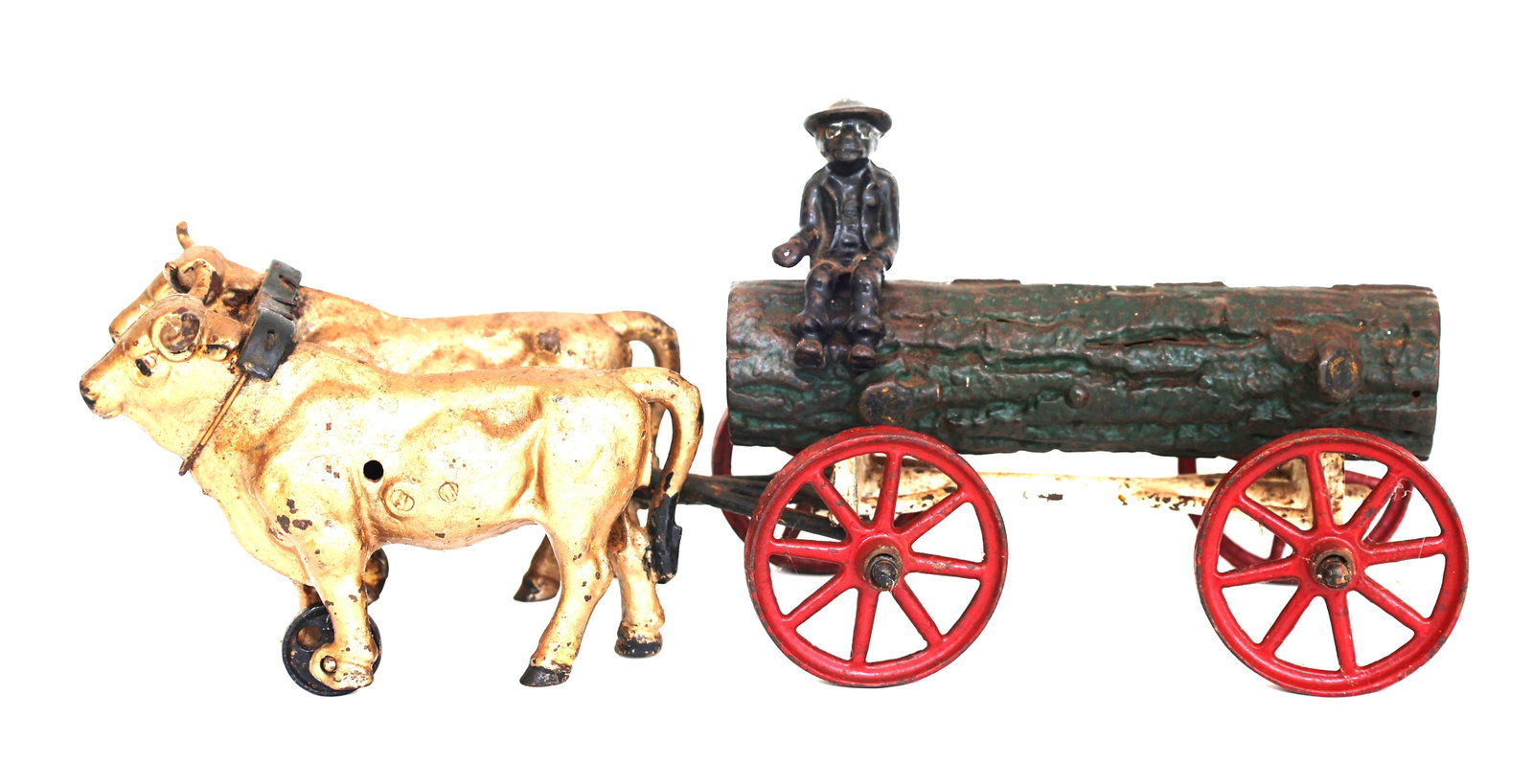 vintage cast iron toy oxen pulling a log wagon with a rider, lmanufactured by Hubley or Kenton (1 of 8)