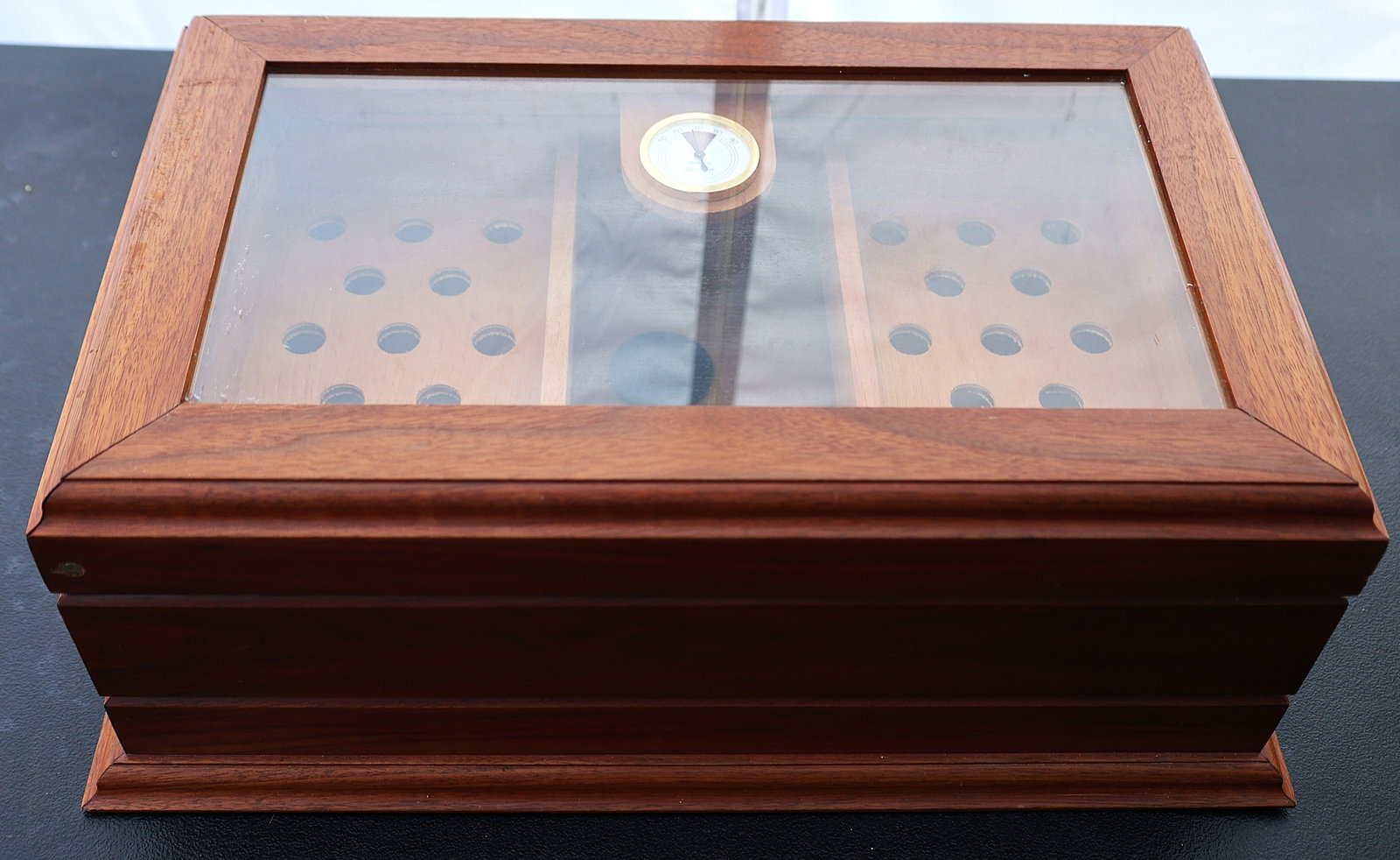 This is a desktop cigar humidor made from cedar wood with a glass top display window.It includes a b (1 of 7)