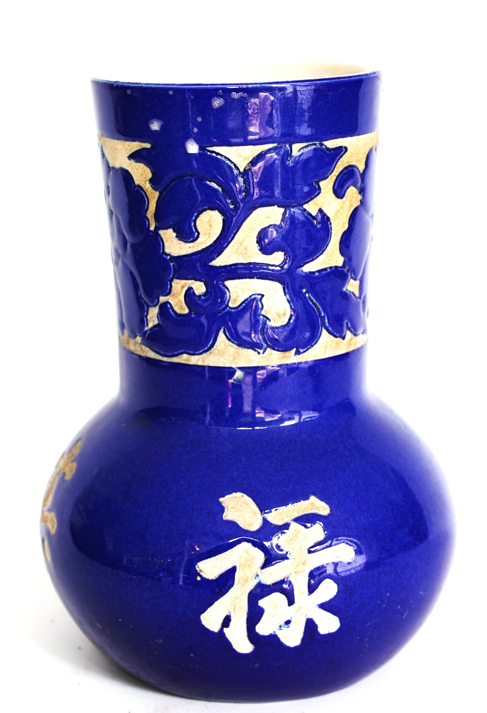 Chinese blue porcelain vase features incised cherry blossom designs and a bulbous body: Size: 9 in. height, 4 in. top, 5 1/2 in. bulbous; Chinese blue porcelain vase features incised cherry blossom designs and a bulbous body