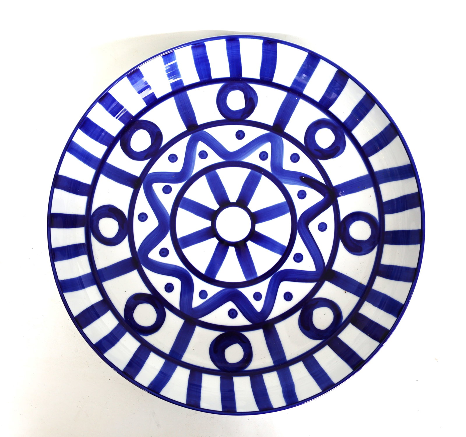 Dansk Arabesque plate featuring a blue and white geometric pattern: Size: 1 1/2 in. height x 13 inches diameter ; Dansk Arabesque plate featuring a blue and white geometric pattern