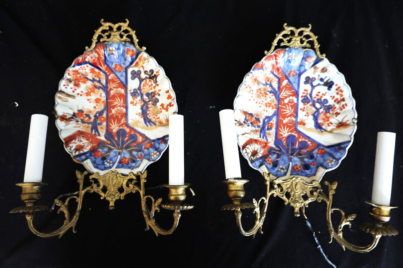 pair of antique Japanese Imari porcelain wall sconces decorated with traditional iron red, cobalt: Size: 14 in. x 10 in. ; These items are a pair of antique Japanese Imari porcelain wall sconces decorated with traditional iron red, cobalt blue, and gilt accents. Circa 1860.