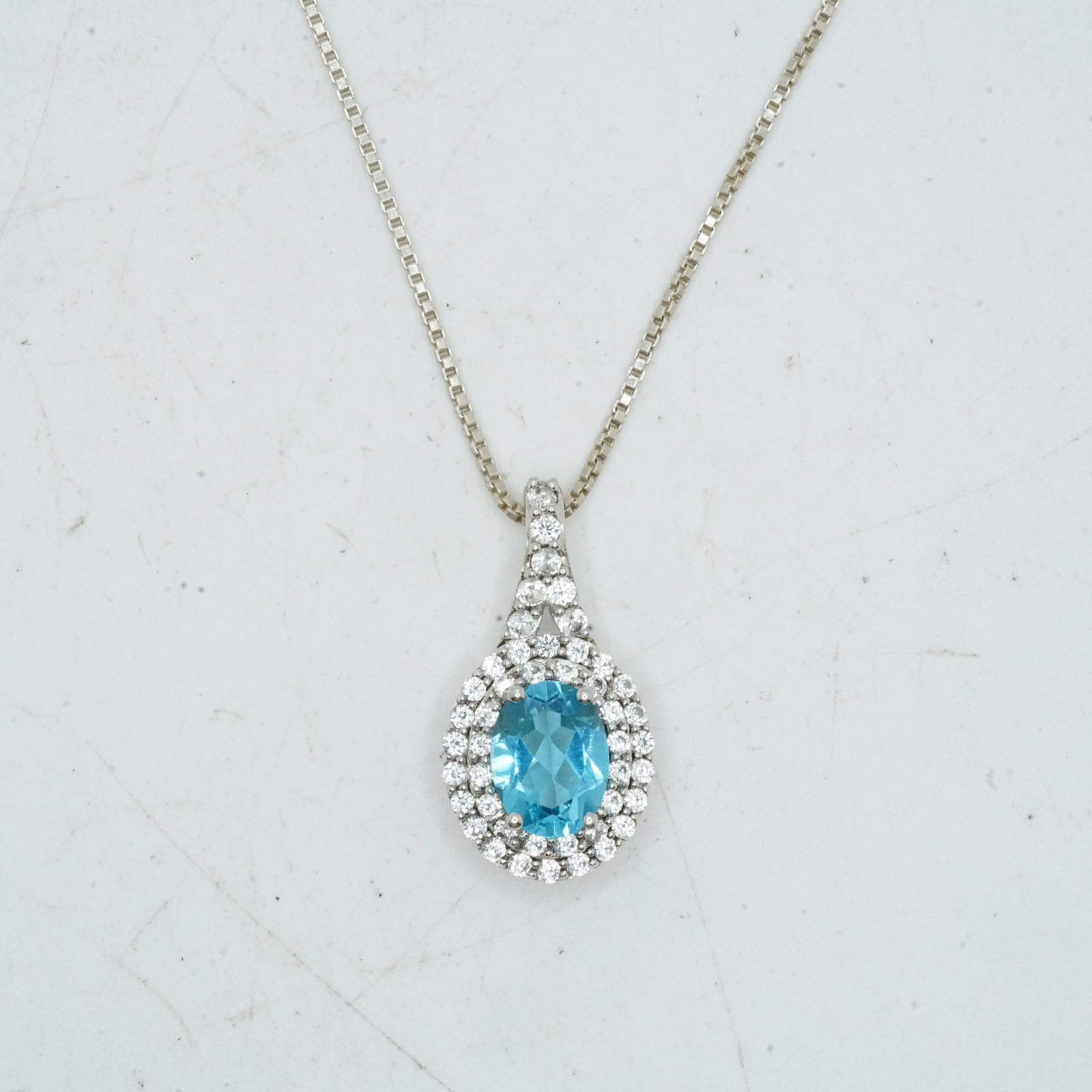 .925 Sterling Silver 3.65 Grams, SUN Blue Topaz and White Topaz Pendant Necklace: .925 Sterling Silver 3.65 Grams, SUN Blue Topaz and White Topaz Pendant 1/2 in. x 7/8 in. Necklace on .925 Sterling Silver 17 in. Chain.