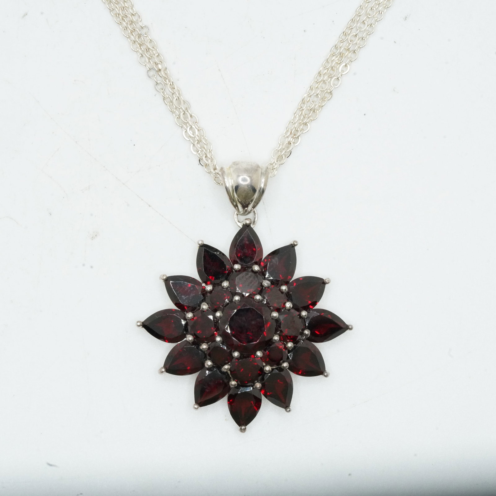 .925 Sterling Silver 14.10 Grams, Garnet Star Pendant Necklace on .925 Sterling 18 in. [3] Chains: .925 Sterling Silver 14.10 Grams, Garnet Star Pendant Necklace on .925 Sterling 18 in. [3] Chains. pendant size 1 3/4 in. x 1 3/8 in.