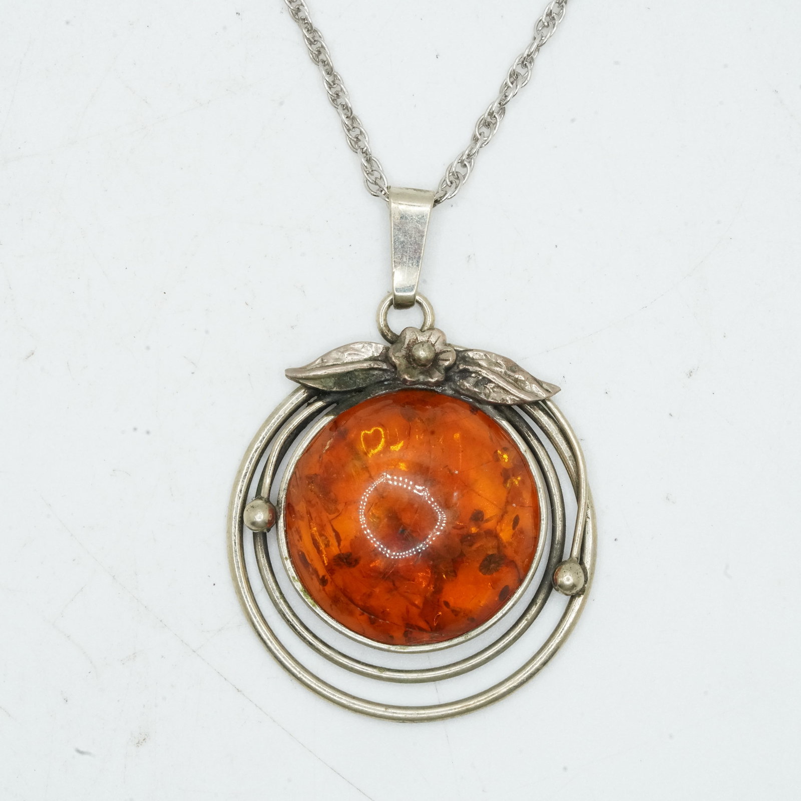 Sterling Silver 10.46 Grams, Native American Indian Amber Center Round Pendant Necklace: Sterling Silver 10.46 Grams, Native American Indian Amber Center Round Pendant Adorned with Leaves and Rosette Necklace on a Sterling Silver 20 in. Chain