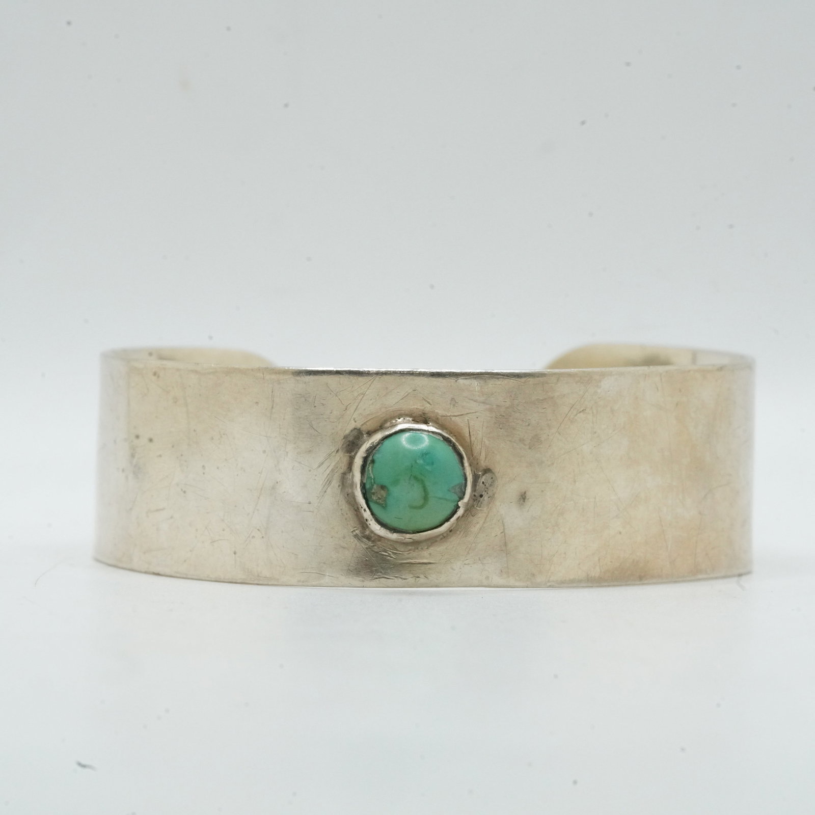 Sterling Silver 23.09 Grams, Native American Indian Cuff Bracelet with Turquoise Center Stone: Sterling Silver 23.09 Grams, Native American Indian Cuff Bracelet with Turquoise Center Stone. Size: 2 3/8 in. x 2 in. x 7/8 in.
