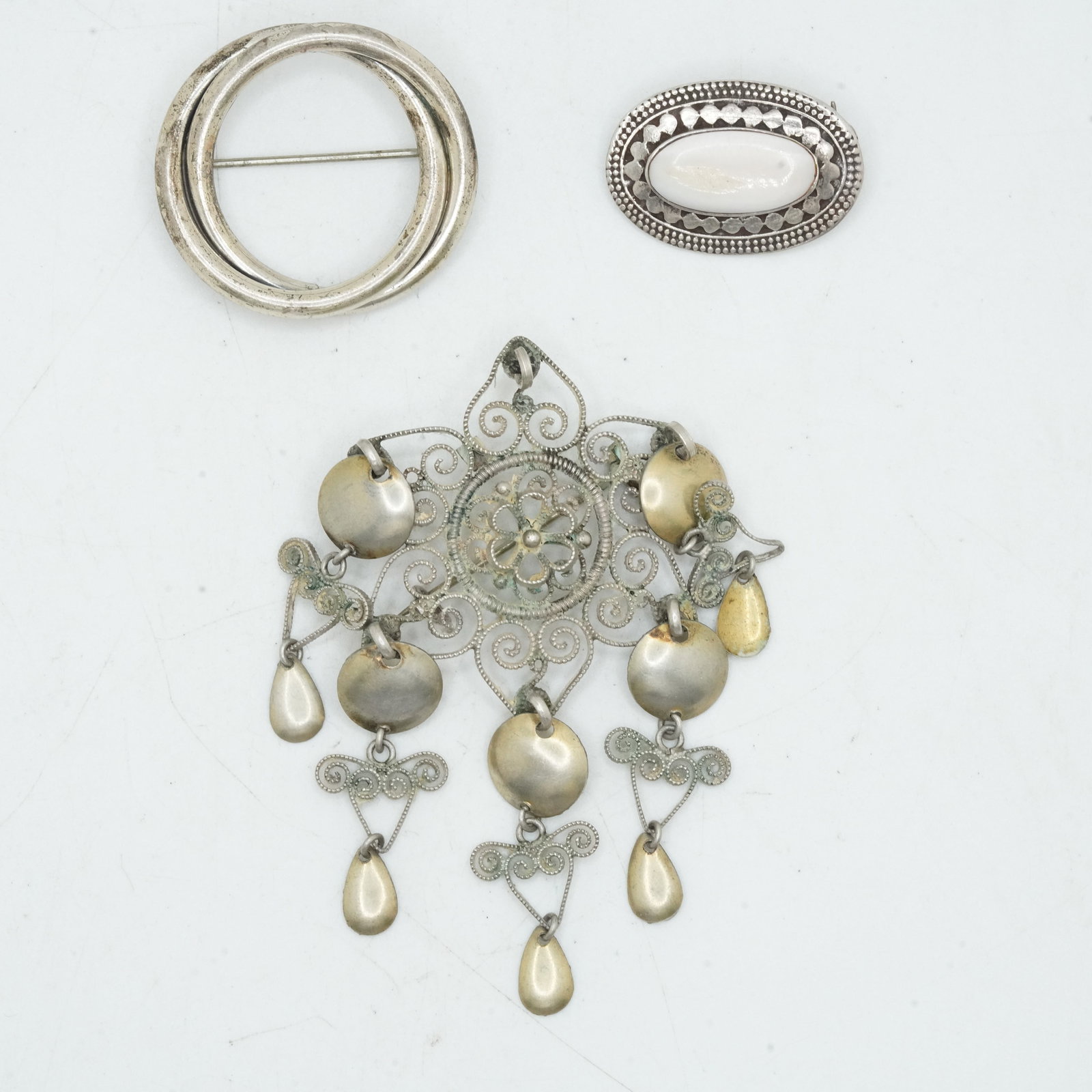 23.53 Grams .925 Sterling Silver H Norweigian Silje Pin with Dangling Charms, .925 MOP Oval: 23.53 Grams .925 Sterling Silver H Norweigian Solje Pin with Dangling Charms 3 in. x 2 in., .925 MOP Oval Pin 1 in. 3/4 in.; Sterling by Jeweler 1 1/4 in.