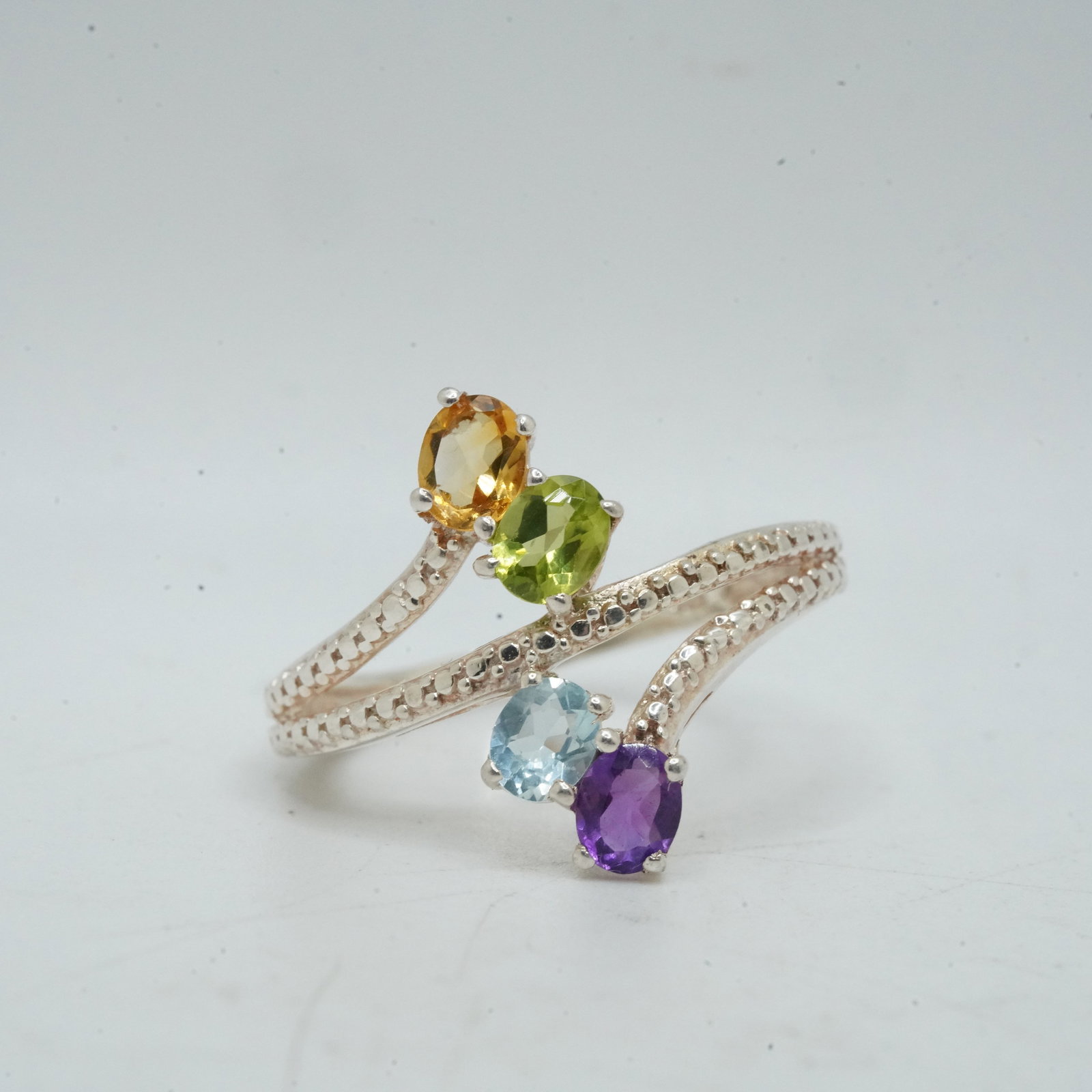 3.53 Grams .925 Sterling Silver Blue Topaz , Purple Amethyst , Peridot and Citrine Ring Size 8: 3.53 Grams .925 Sterling Silver Blue Topaz , Purple Amethyst , Peridot and Citrine Ring Size 8 ; 1 in. x 3/4 in.