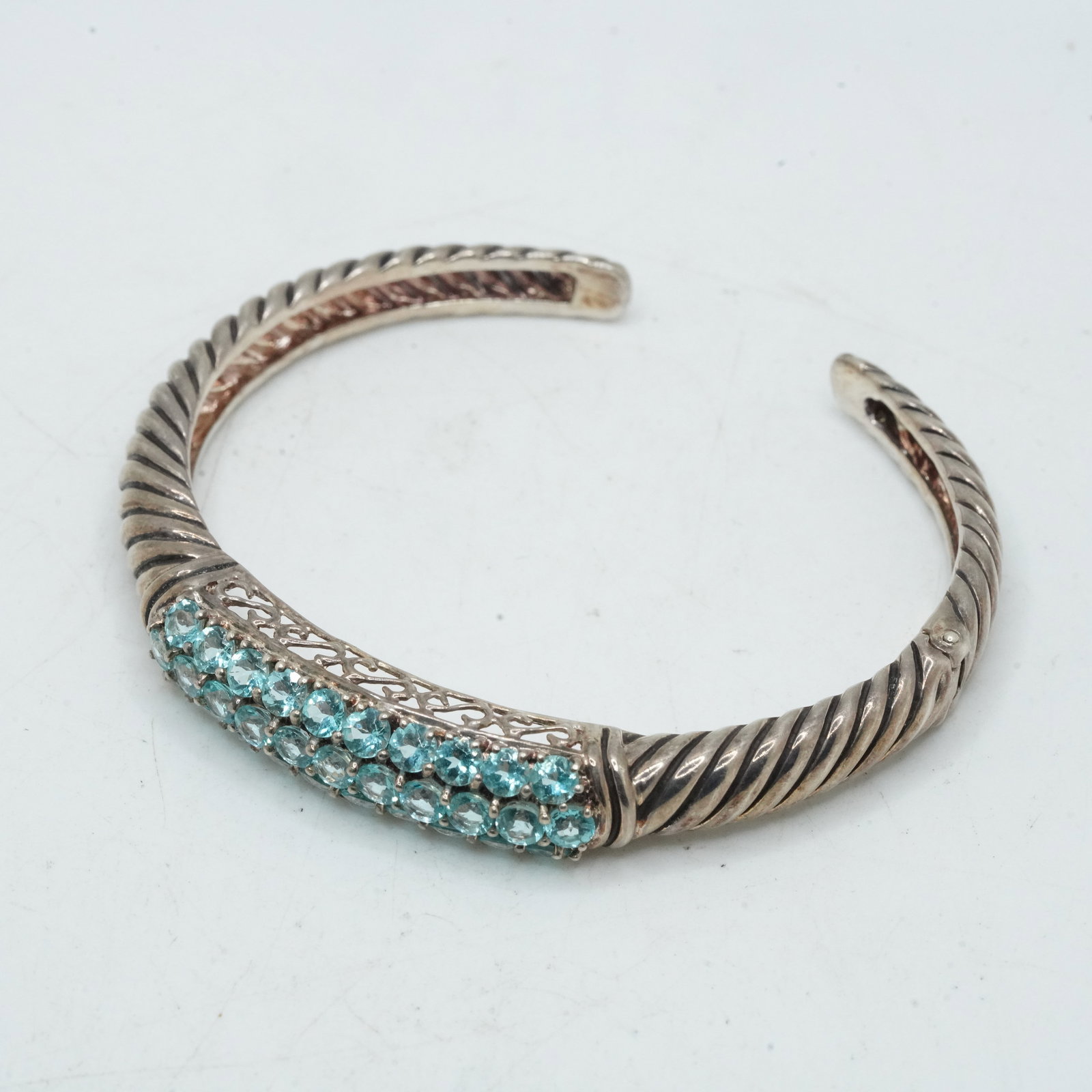 21.39 Grams .925 Sterling Silver Blue Topaz Rope Twist Cuff Bracelet with Stainless Steel Hinge: 21.39 Grams .925 Sterling Silver Blue Topaz Rope Twist Cuff Bracelet with Stainless Steel Hinge.