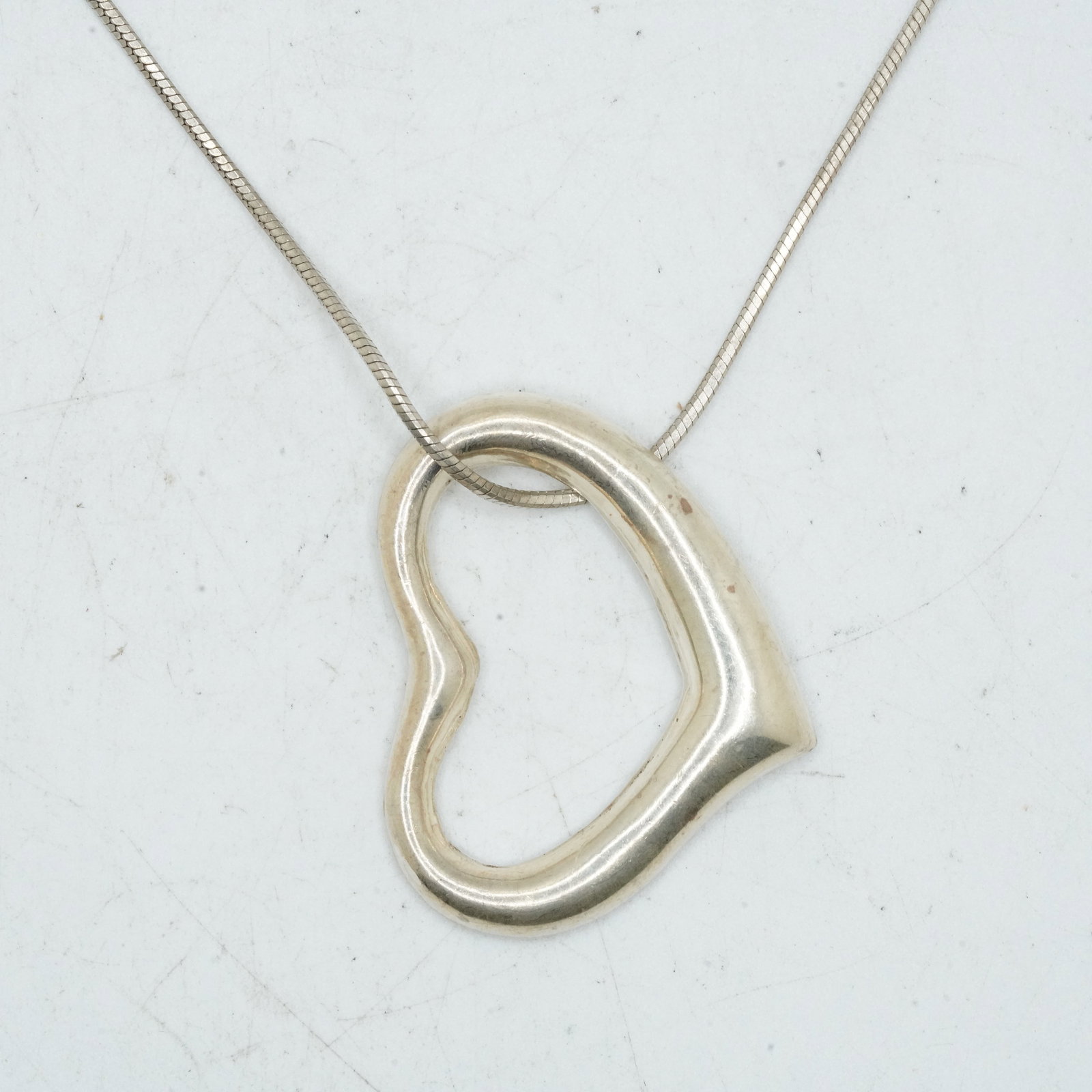 11.86 Grams .925 Sterling Silver Open Heart Pendant Necklace on .925 Italy Snake 18 in. Chain: 11.86 Grams .925 Sterling Silver Open Heart Pendant Necklace on .925 Italy Snake 18 in. Chain; pendant 1 1/4 in. x 1 1/8 in., 925 C-11 Mexico