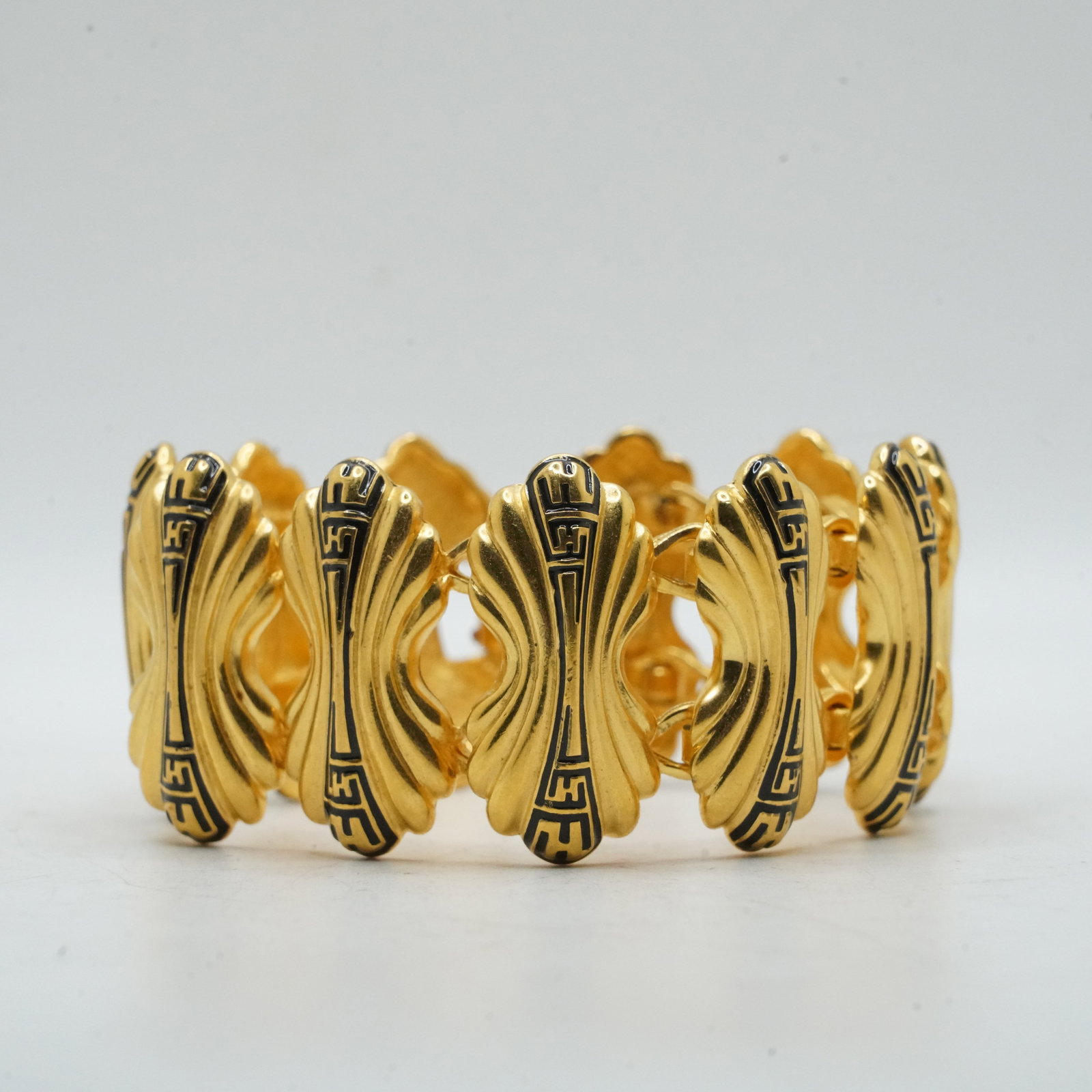 FENDI Gold Tone with Black Enameling Design 11-Panels Bracelet, 7 in. x 1 1/4 in.: FENDI Gold Tone with Black Enameling Design 11-Panels Bracelet, 7 in. x 1 1/4 in.