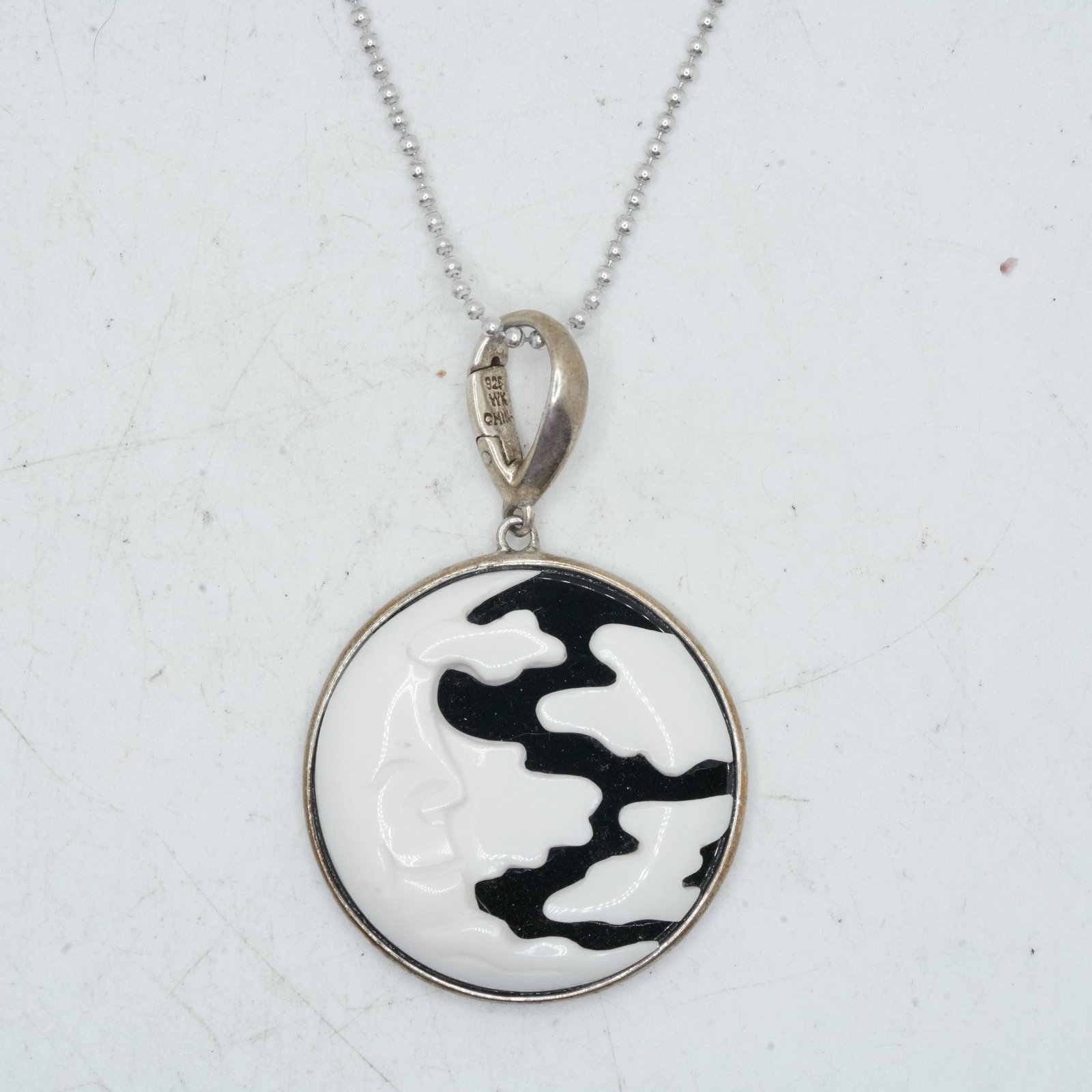 14.77 Grams .925 Sterling WK Man and The Moon Pendant; .925 Sterling Italy 20 inch Bead Chain: 14.77 Grams .925 Sterling WK Man and The Moon Pendant; .925 Sterling Italy 20 inch Bead Chain. Pendant Size: 2 in. x 1 1/4 in.