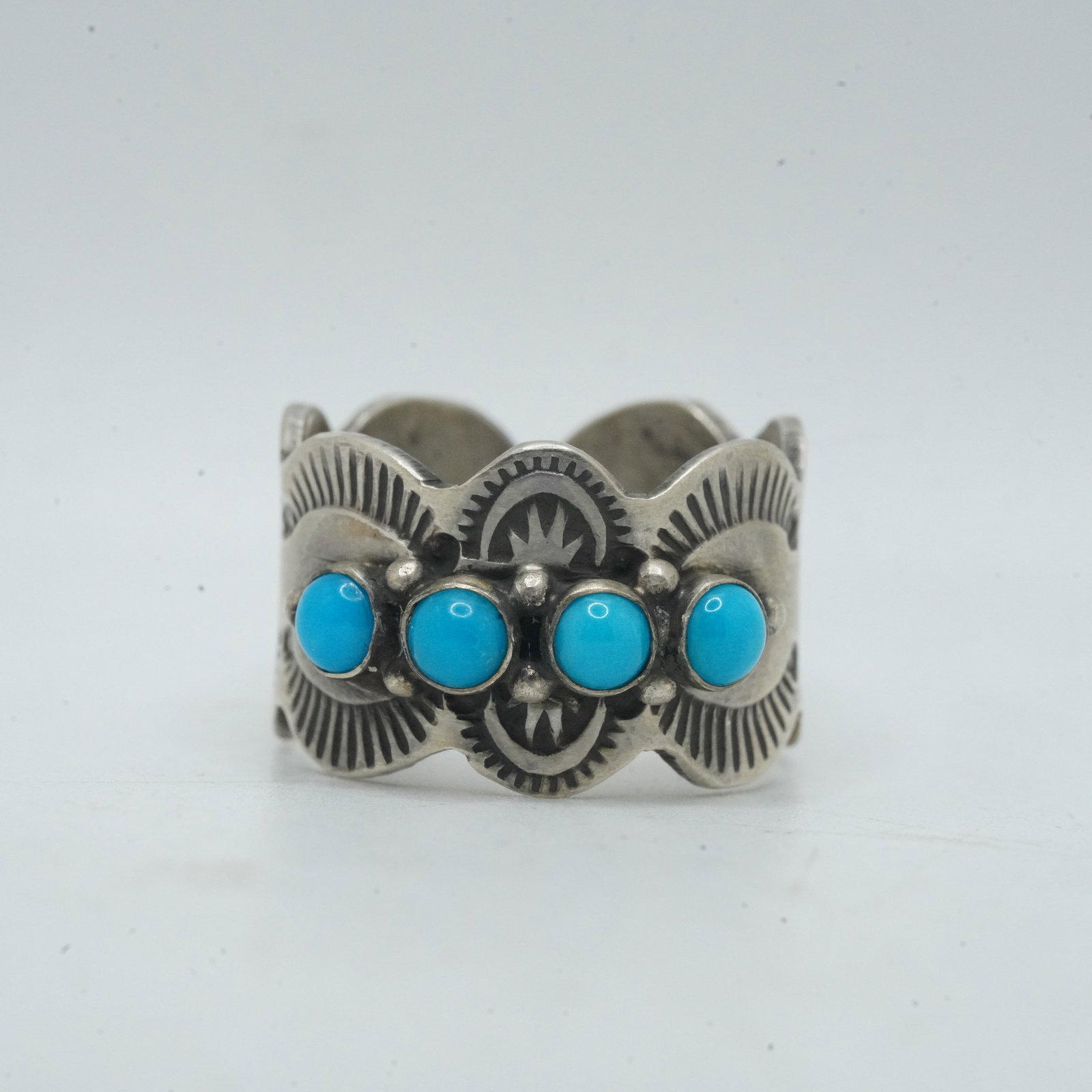 7.60 Grams .925 Sterling Silver Native American Indian Turquoise Band Ring Size 8, Signed: 7.60 Grams .925 Sterling Silver Native American Indian Turquoise Band Ring Size 8, Signed initials E, Etta Endito Navajo. Sunrise Symbols, 3/4 in. x 1/2 in.