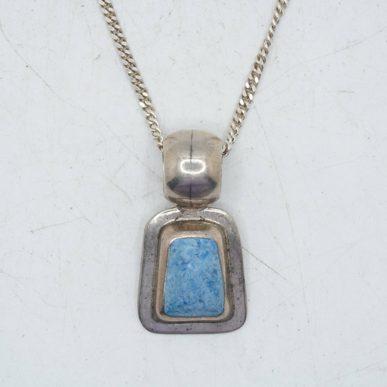 16.69 Grams .925 Sterling Silver AT1 Pendant with Inlaid Turquoise Stone Necklace on .925 Italy: 16.69 Grams .925 Sterling Silver Mexico AT1 Pendant with Inlaid Turquoise Stone Necklace on .925 Italy 16 in. Chain, pendant size 1 1/2 in. x 3/4 in.