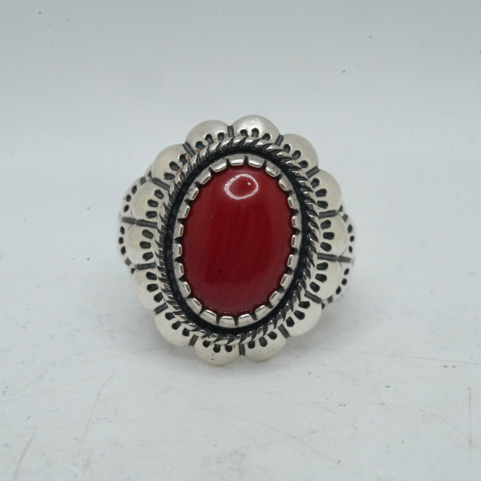 9.64 Grams .925 Sterling Silver CR CAROLYN POLLACK Coral Stone Ring Size 8.5 Set into a: 9.64 Grams .925 Sterling Silver CR CAROLYN POLLACK Coral Stone Ring Size 8.5 Set into a Feather and Sunrise Symbols , 7/8 in. x 1 in.