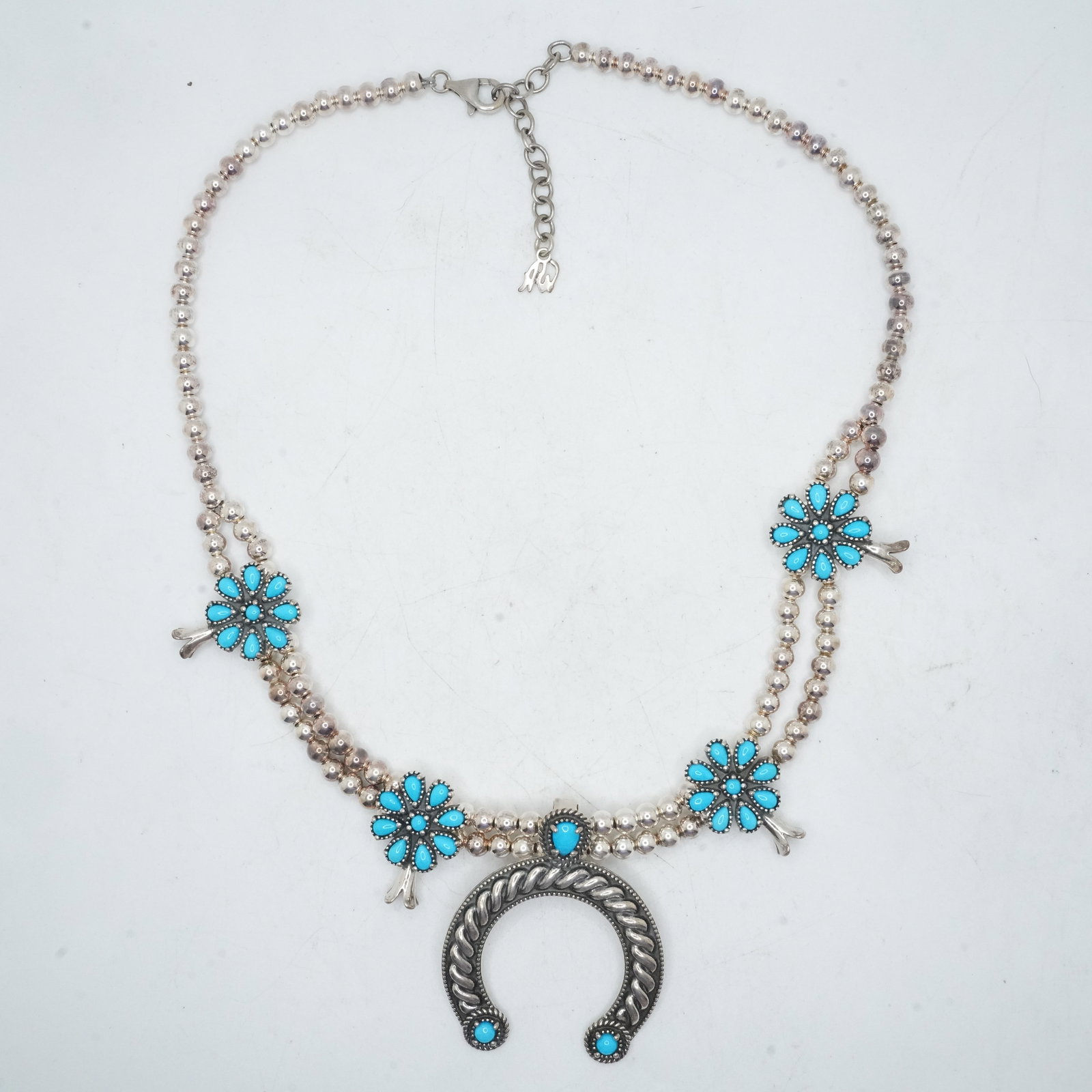 53.19 Grams .925 Sterling Silver CR CAROLYN POLLACK Cluster Squash Blossom Necklace: 53.19 Grams .925 Sterling Silver CR CAROLYN POLLACK Cluster Squash Blossom Necklace "Naja" is removable Natural Sleeping Beauty Turquoise, Naja Rosettes Chain. Size: 20 in. x 1 3/4 in. x 1 in. x 3/4 i