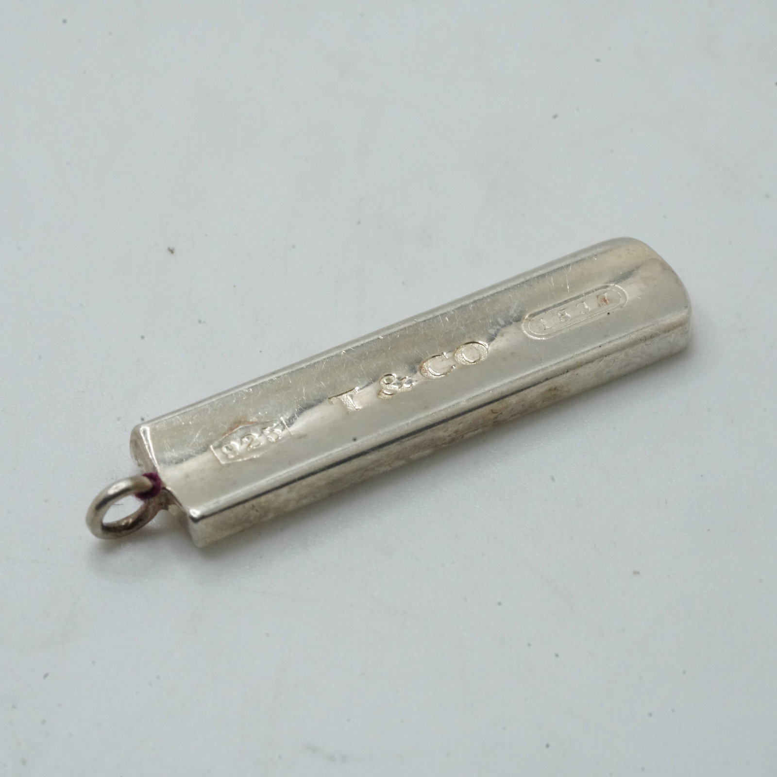 8.14 Grams .925 Sterling Silver TIFFANY & CO 2001 Bar Pendant, 1 5/8 in. x 3/8 in.: 8.14 Grams .925 Sterling Silver TIFFANY & CO 2001 Bar Pendant, 1 5/8 in. x 3/8 in.