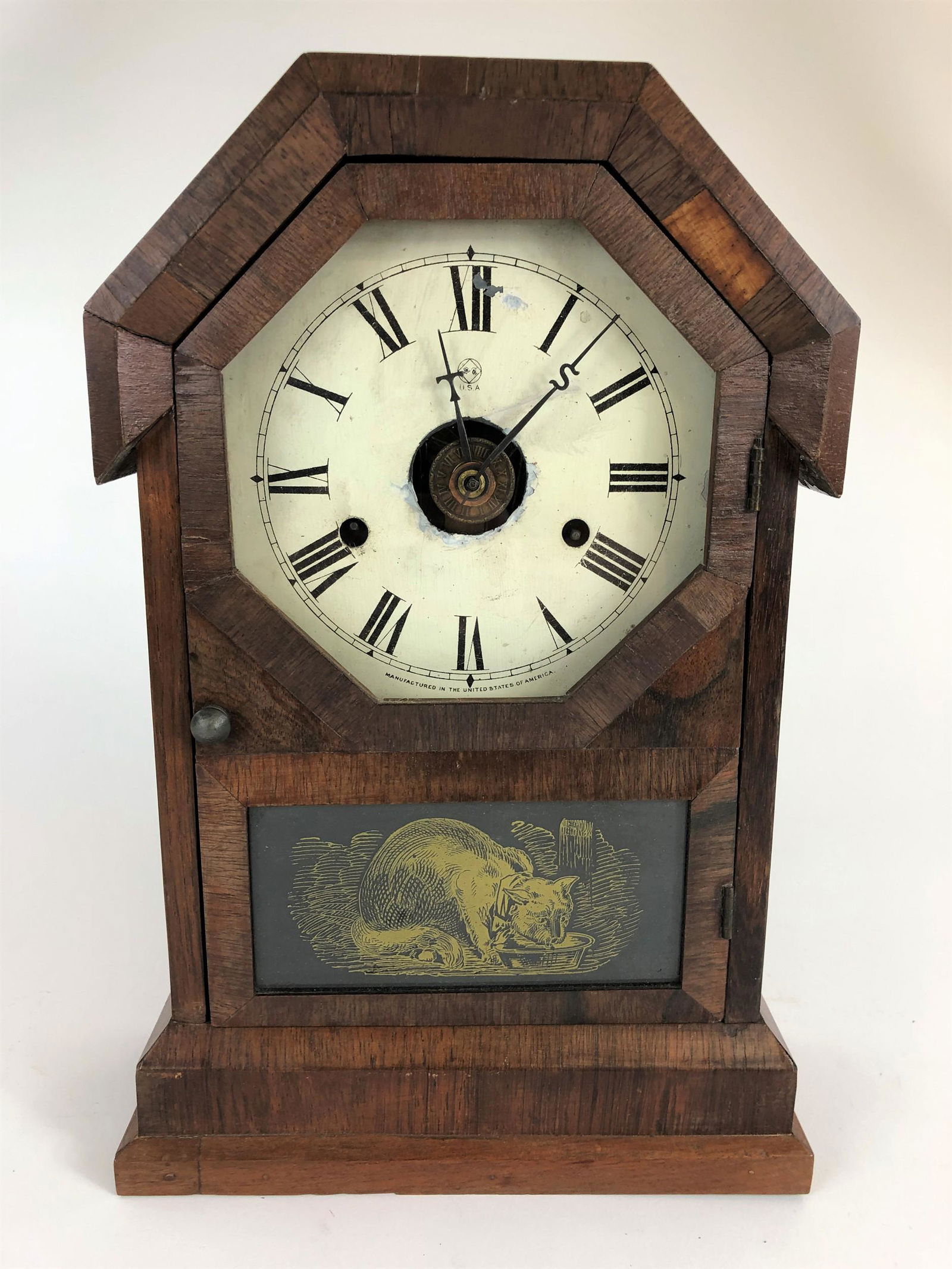 Seth Thomas Shelf Clock: A Seth Thomas shelf clock with veneer surface to case, and printed dial, with wolf transfer glass panel; ht. 14.5", wd. 9.5", dp. 4".