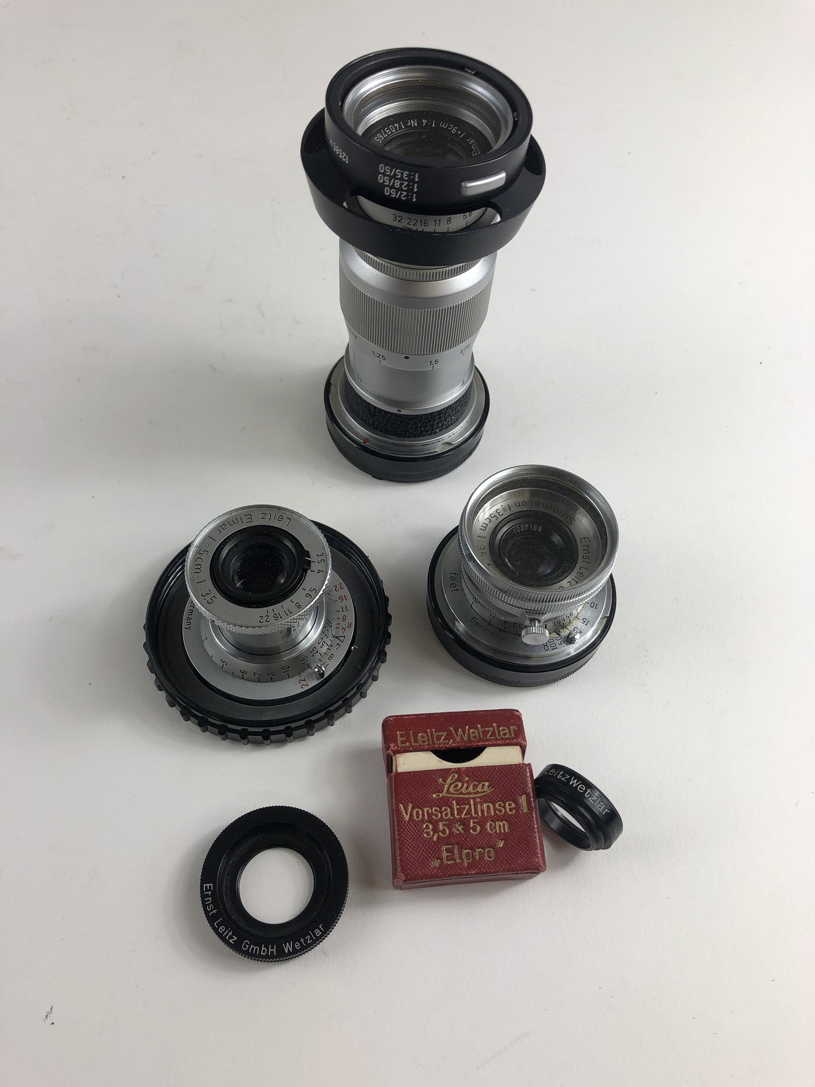 Three Leica/Leitz Lenses Including: Leitz Elmar f=5cm: Three Leica/Leitz Lenses Including: Leitz Elmar f=5cm 1:3.5 Lens, Leitz Summaron f=3.5cm 1:3.5 Lens and a Leitz Elmar f=9cm 1:4 Lens