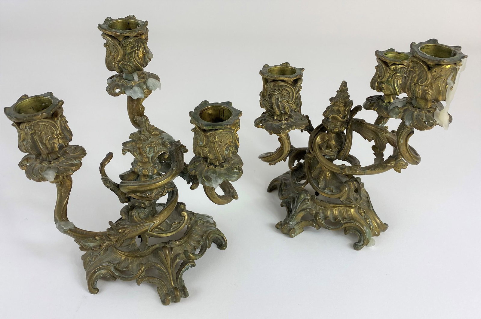 Pair of Rococco Style Ormolu Candlesticks: ht. of each 7.5".