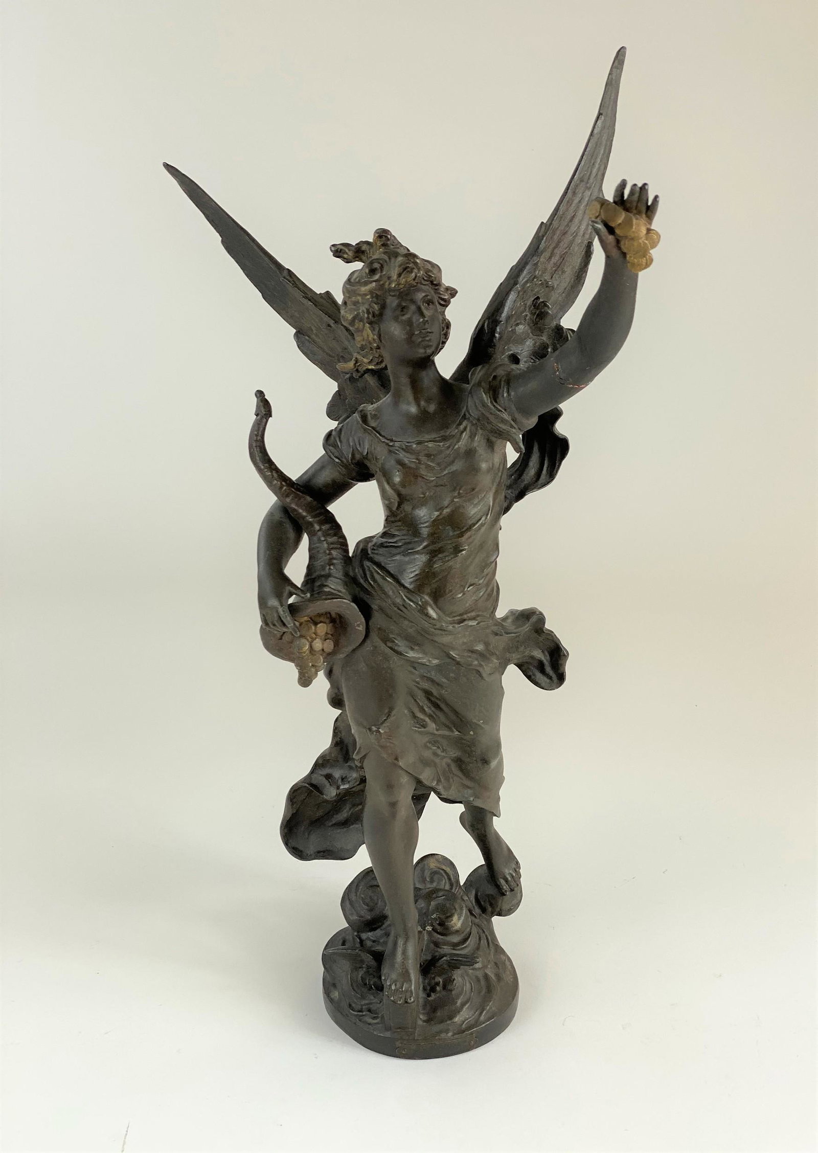 Spelter Sculpture of "La Fortune" After a Model by: A bronze patinated spelter sculpture of a figure, with plaque to base, ht. 25".