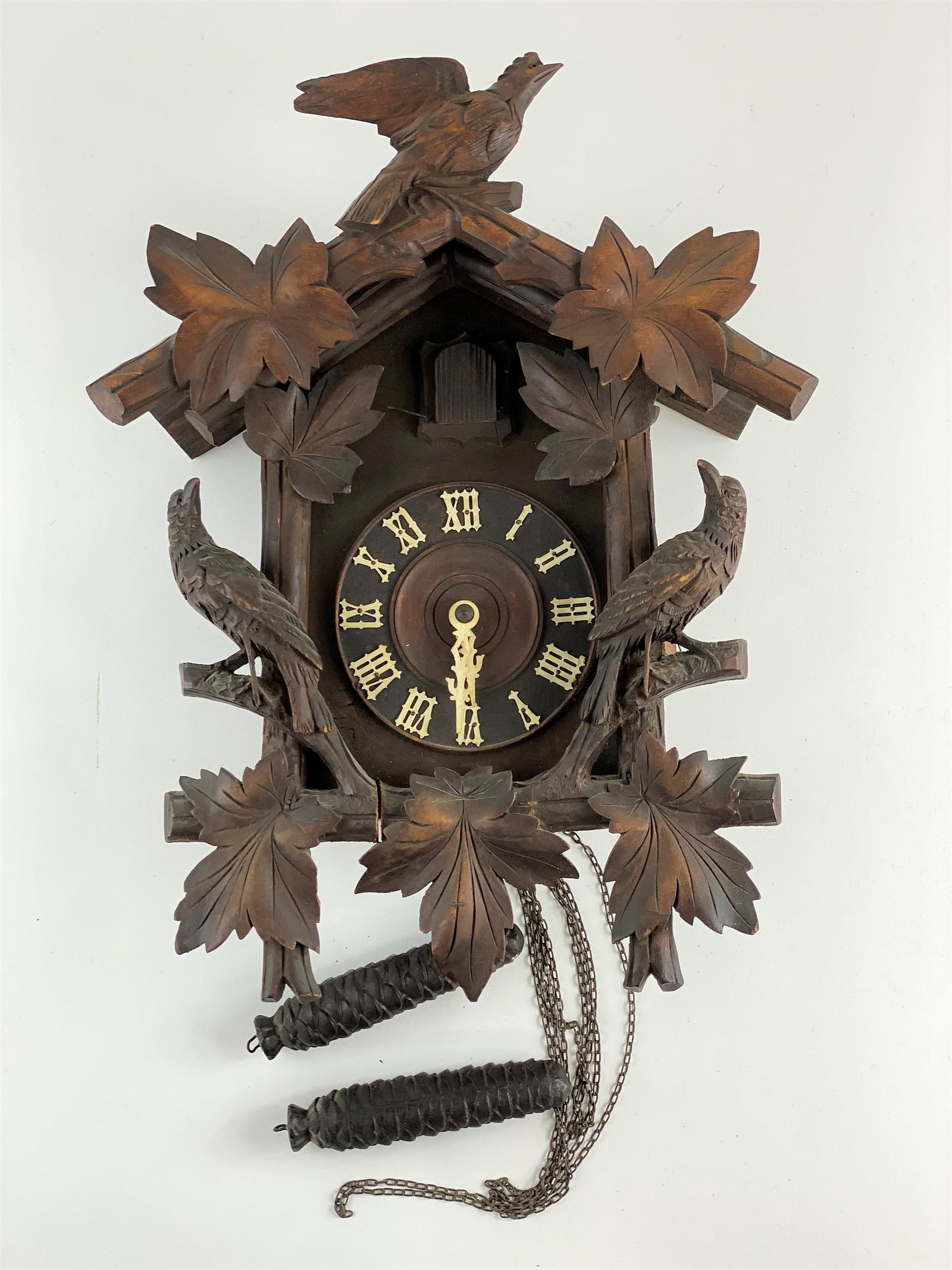 German Carved Cuckoo Clock with Pinecone Weights: Height: 16".