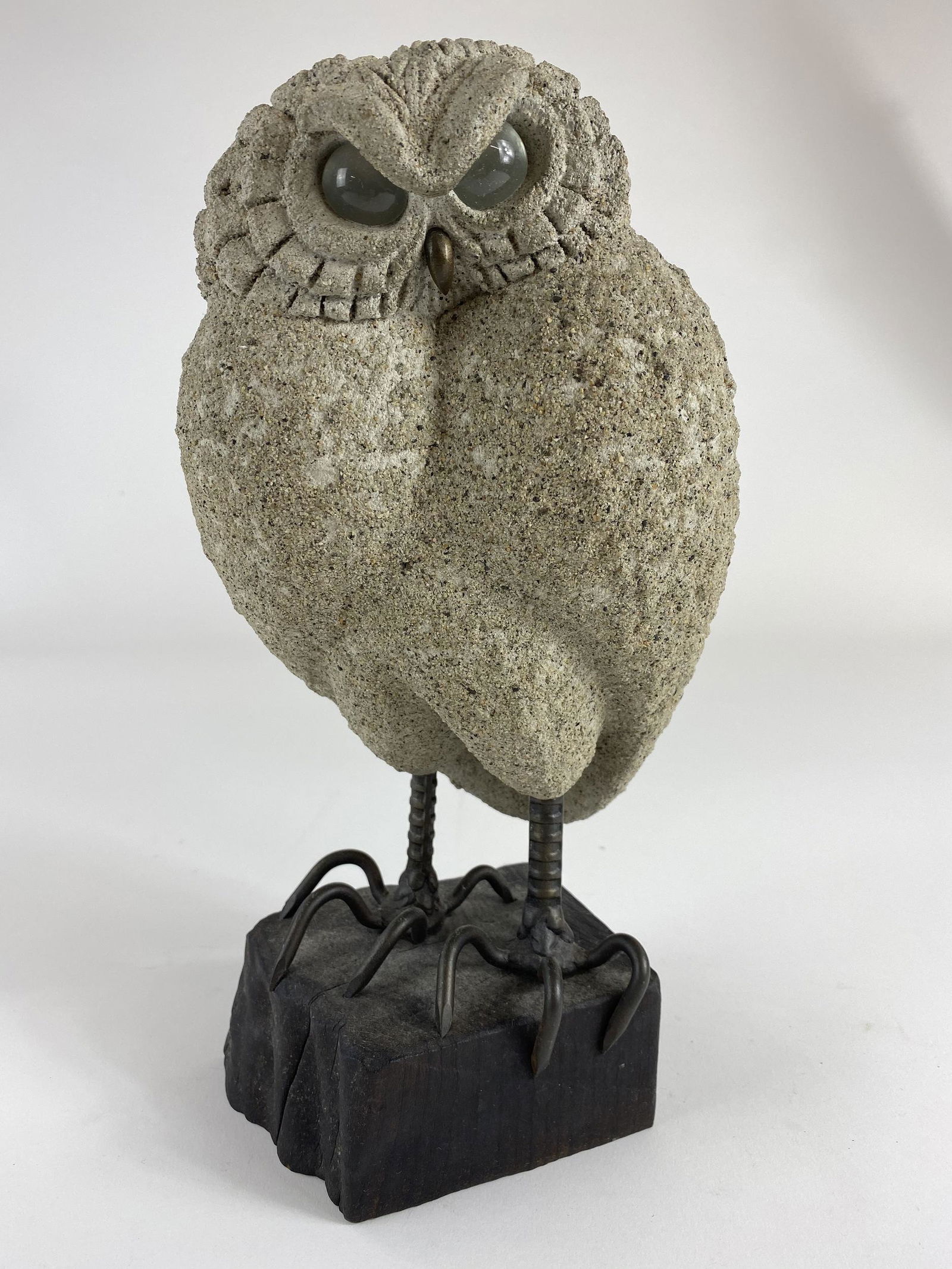 Lou Rankin (1929-2016), Owl Sculpture: Comprised of concrete, nails and wood base, a fabulous owl sculpture with glass eyes by Lou Rankin; ht. 12.5". Signed and dated 1966 to the underside. Lou Rankin was originally a cartoonist working in