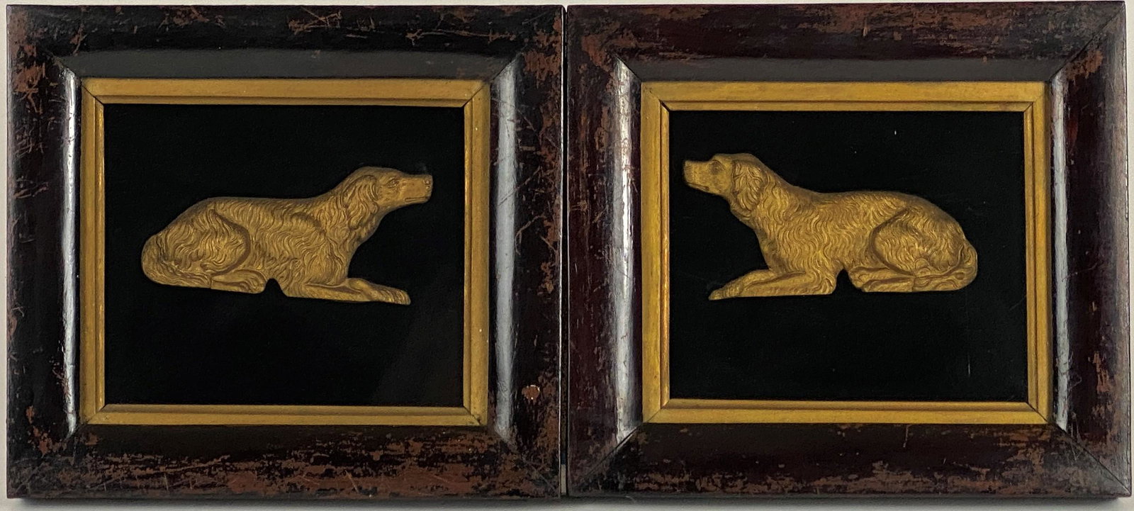 Pair of English Spaniel Relief Bronzes in Shadowbox: Late 19th or early 20th century, a pair of bronze spaniels in relief, housed in shadow box frames, each with Closson's gallery labels; each 9" x 10.5" (framed).