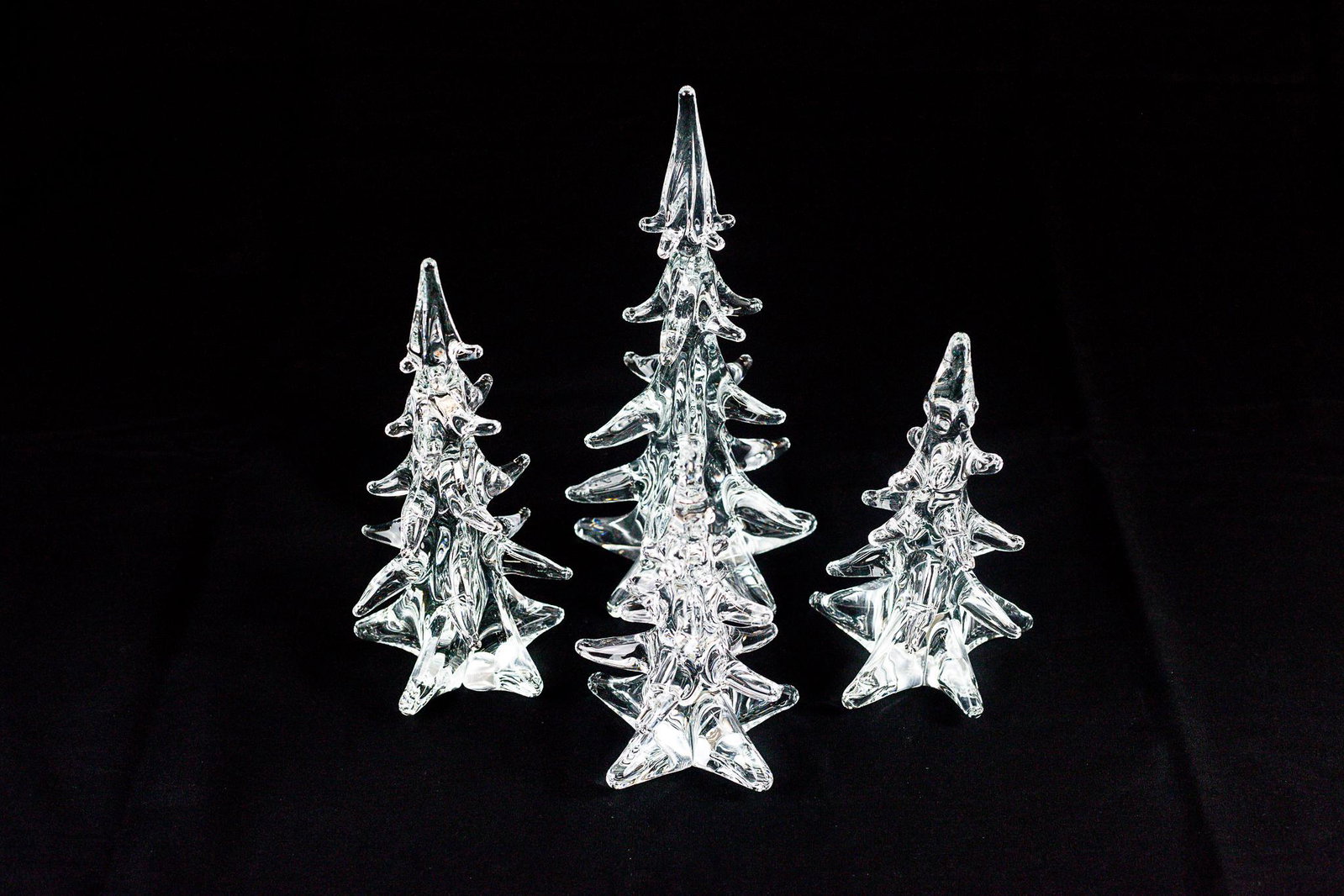 F.M Ronneby Swedish Glass Trees: A group of four glass pine trees, each signed to underside; ht. of tallest 11". Provenance