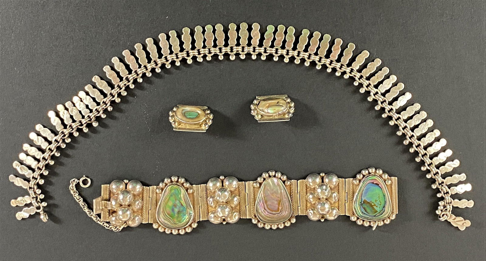 Suite of Taxco Sterling and Abalone Jewelry: Including a bracelet with abalone and ball decoration, marked, and a sterling necklace, as well as a pair of earrings. Provenance<