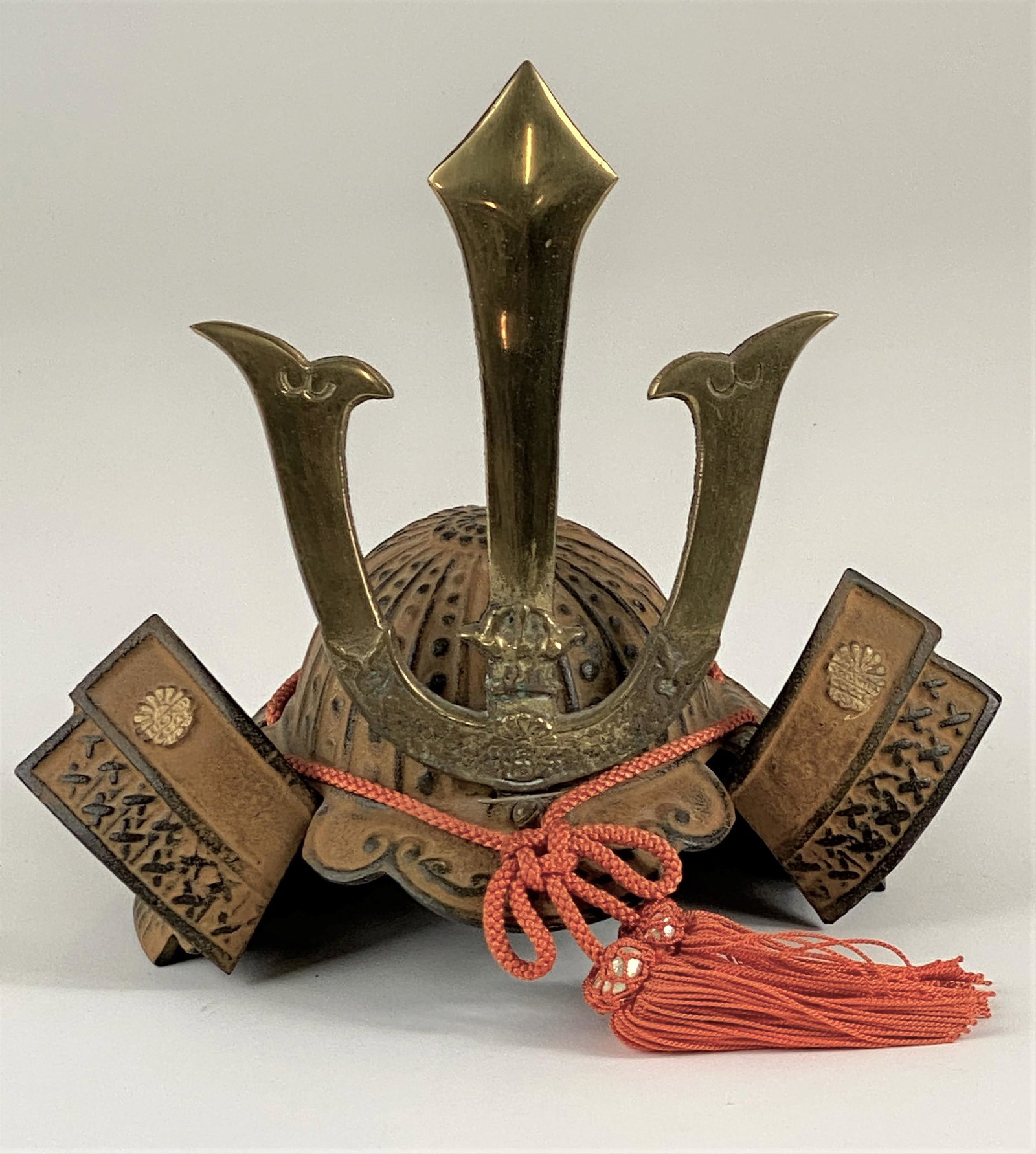A Bronze and Brass Child's Samurai Helmet: ht: 8.5"