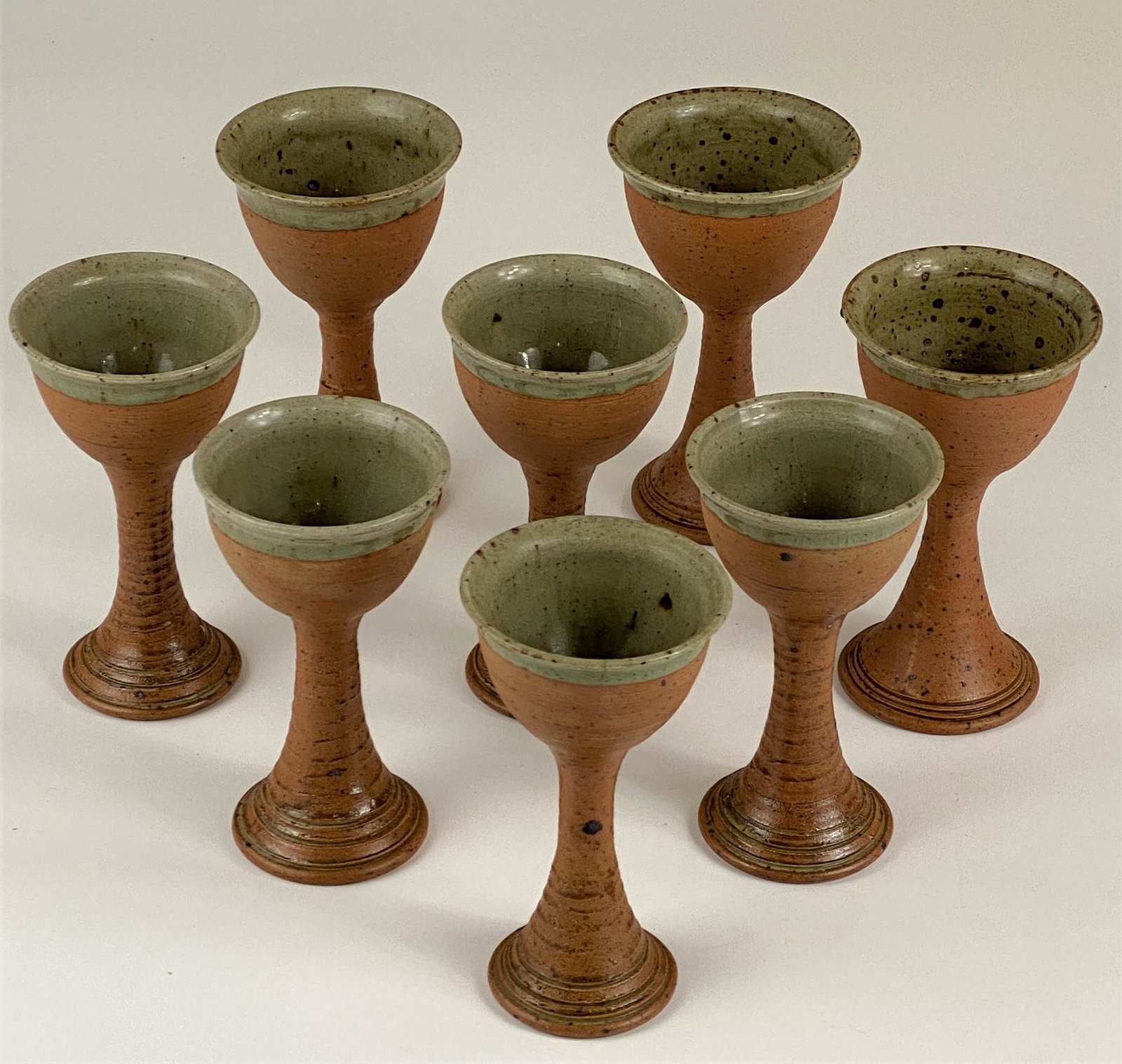 A Collection of 8 Ceramic Goblets: Maker unknown, mark to underside possibly reading "RB"; 6" ht.