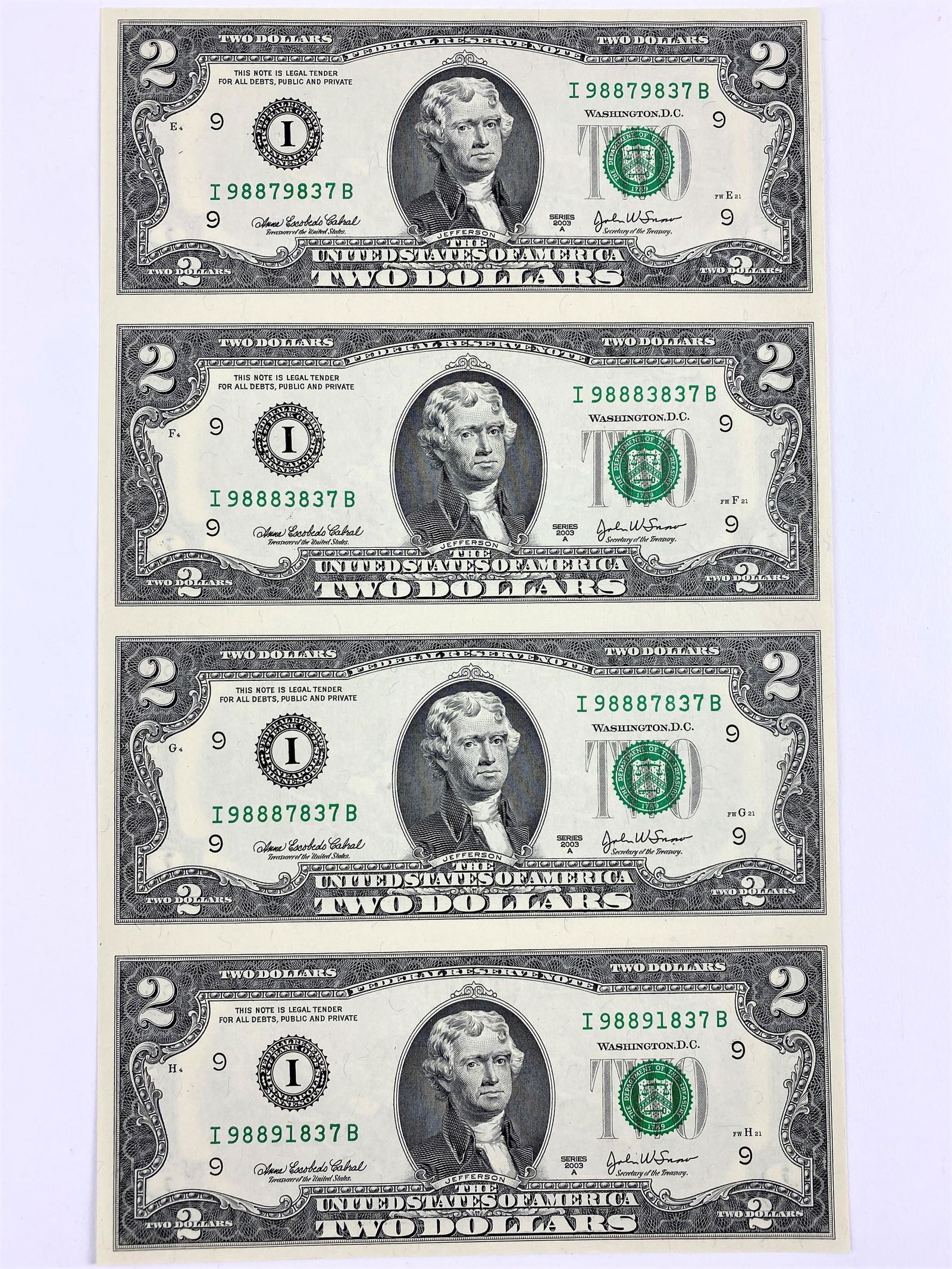 U.S. Government Issued Uncut Sheet of $2 Bills, 2003-A: An uncut sheet of $2 bills with various ephemera related to the item.