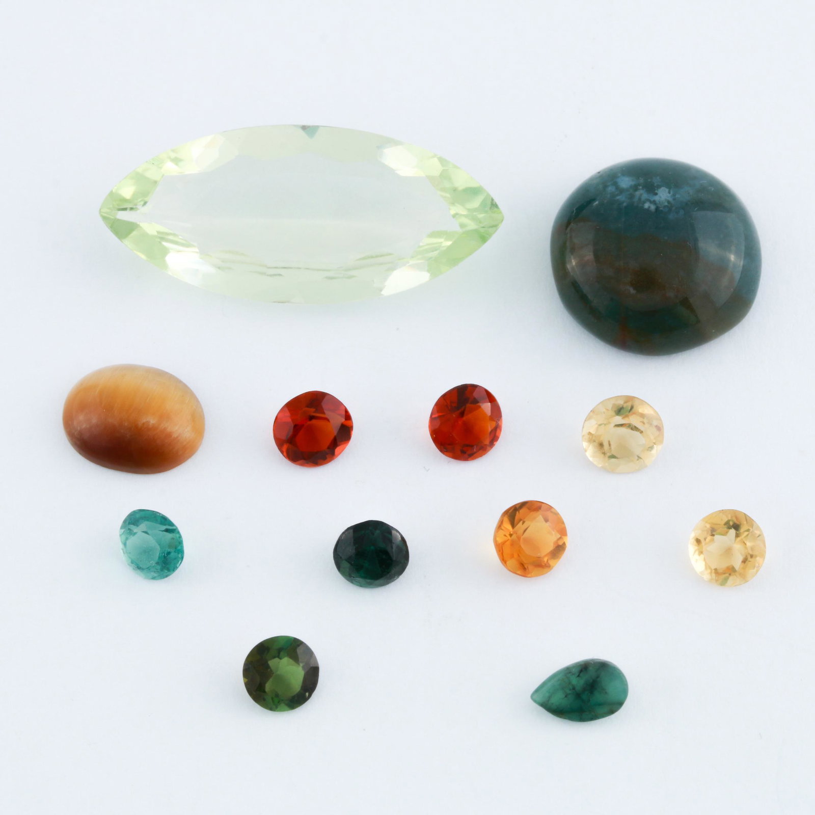 Loose 31.85 CTW Lot of Citrine, Agate, Spinel, Tiger's: 31.85 CTW mixed lot of loose citrine, moss agate, spinel, tiger's eye, and emerald.