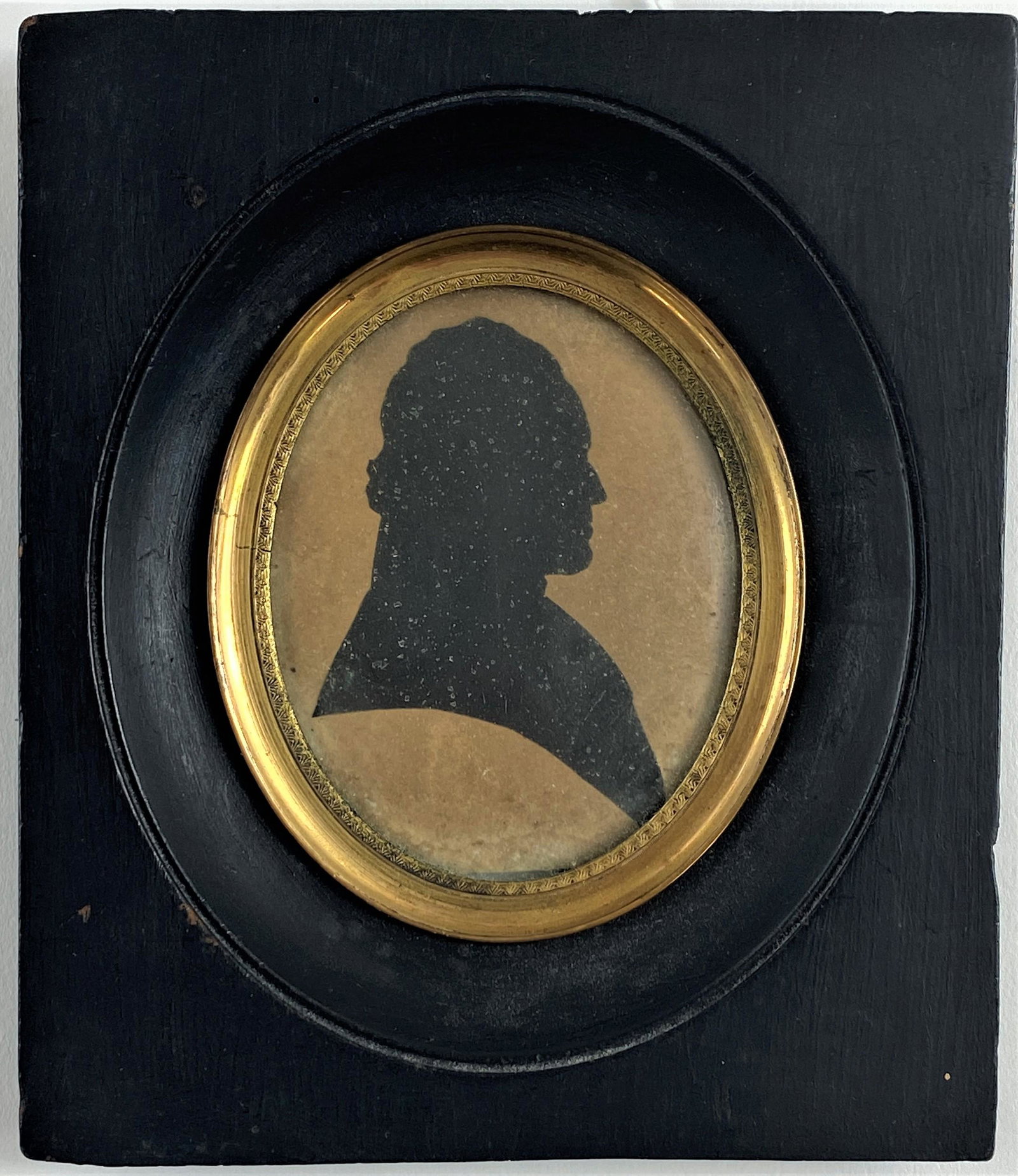 American Silhouette by David Cook, Geneva, NY: Mid-19th century, a profile silhouette in ebonized wood frame, inscribed on verso; 5.5" x 4.5" (framed). Ex Collection of Jane Sikes Hageman, Cincinnati, OH author and collector.