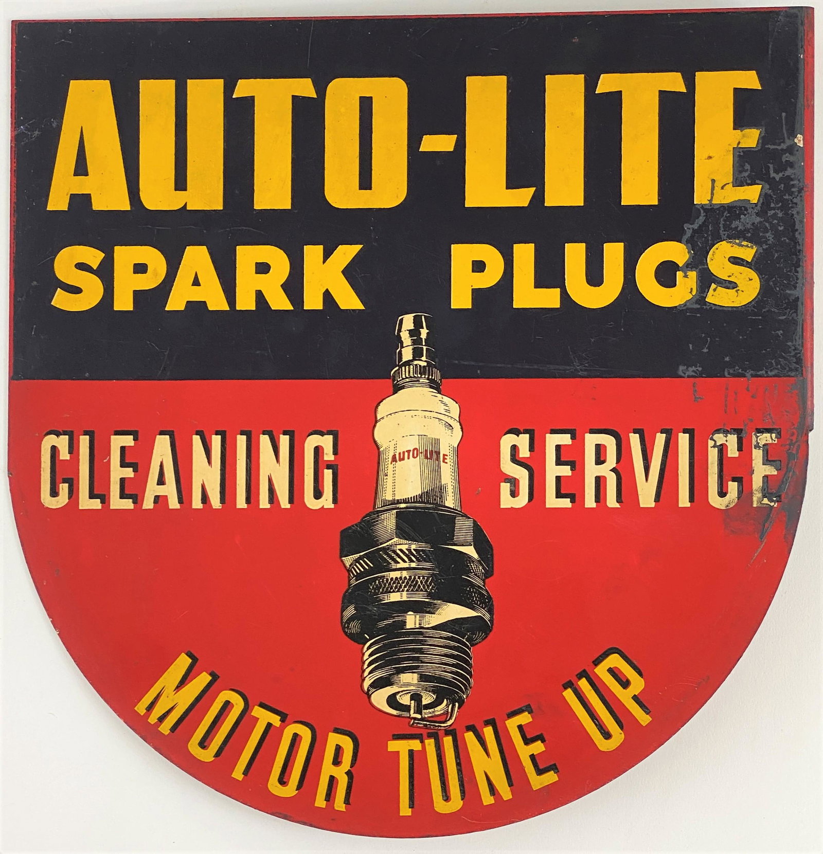 Auto-Lite Spark Plugs Metal Flange Advertising Sign: A hanging sign with three screw-holes, reading "Auto-Lite Spark Plugs, Cleaning Service, Motor Tune up";makers mark "A.M.D Co." on the flange; 11" ht. x 11" wd.