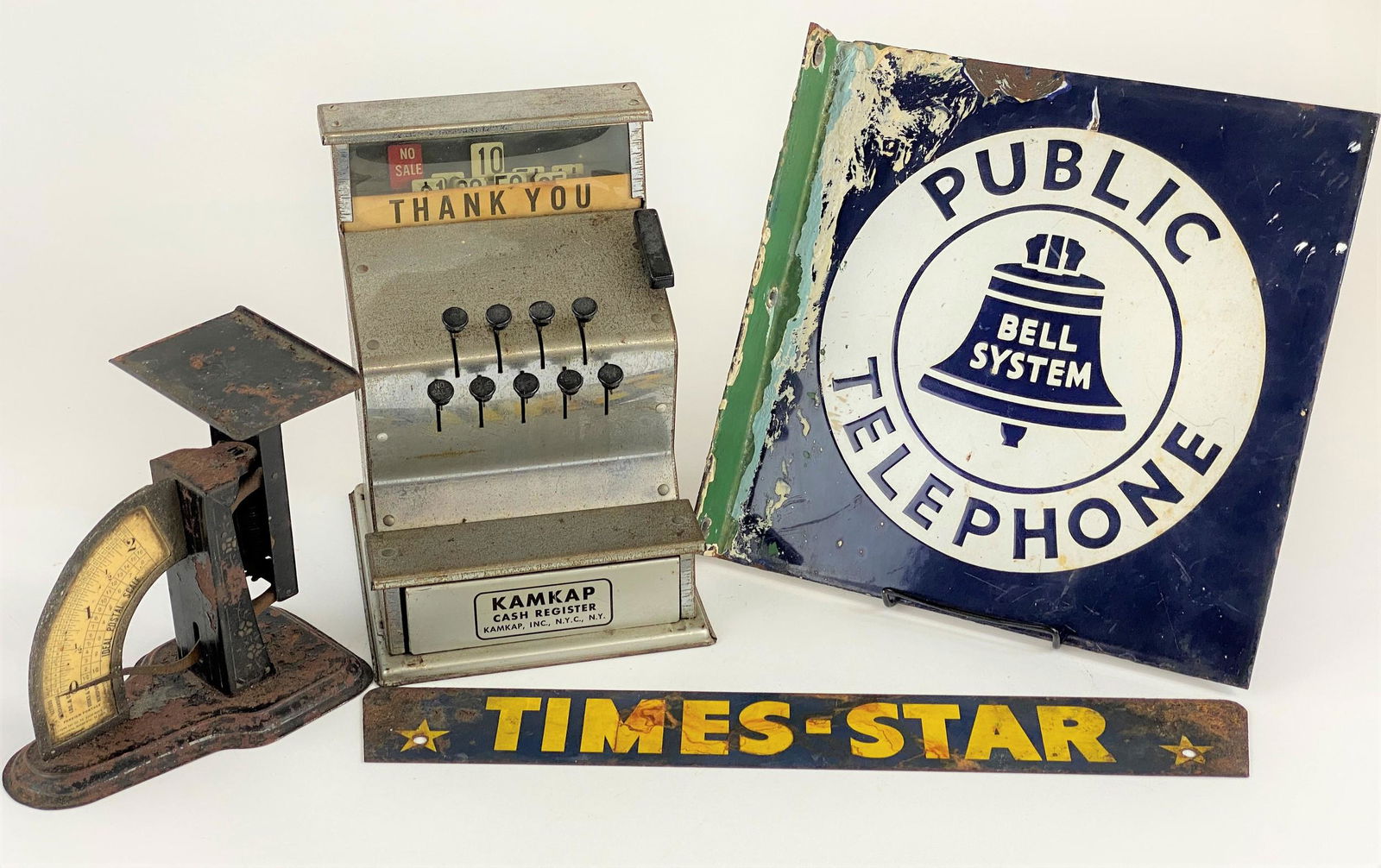 Early 20th Century Tin Advertising, Scale and Cash: A group of 4, including an enamel "Public Telephone" sign, with some corrosion, an "Ideal Postal Scale", a "Kamkap" cash register, and finally a tin "Times Star Sign", telephone sign 11" x 11".