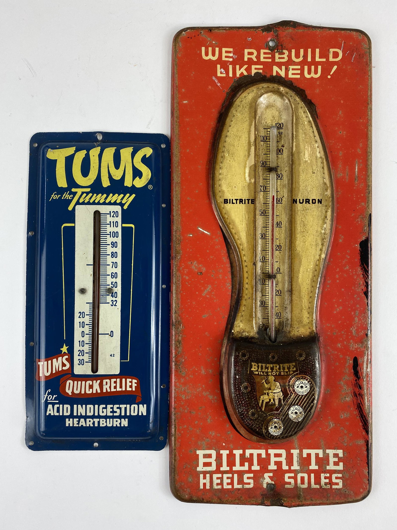 Tums and Biltrite Tin Advertising Thermometers: "Tums for the Tummy" thermometer and a "We Rebuild Like New" Biltrite advertising thermometer; tallest 13.5".