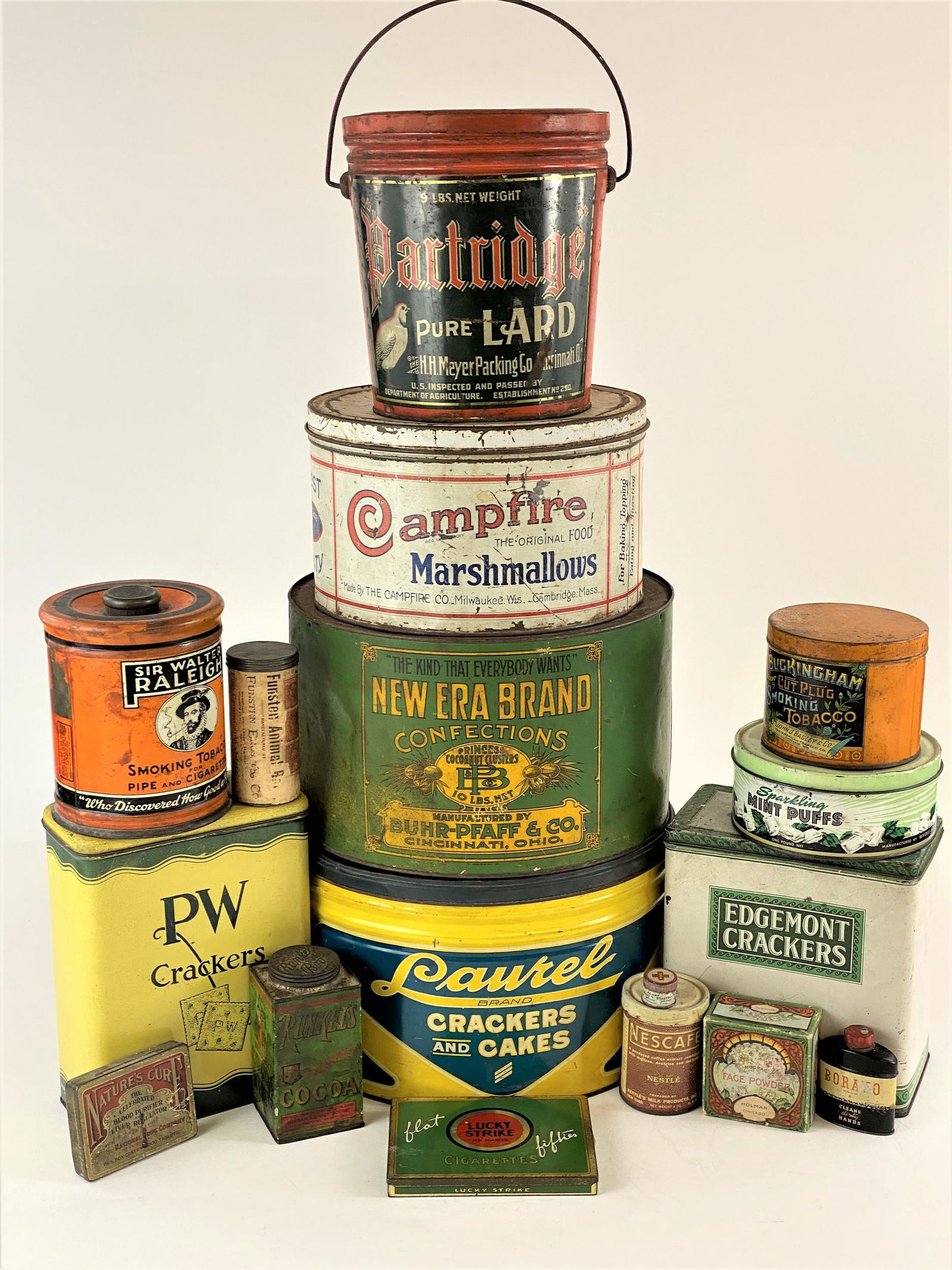 Collection of Tins and Advertising: Highlights include a Cincinnati New Era Brand Confections Tin, a Campfire Marshmallows tin, several tobacco tins, a lard tin, and others; ht. of tallest 9.5".