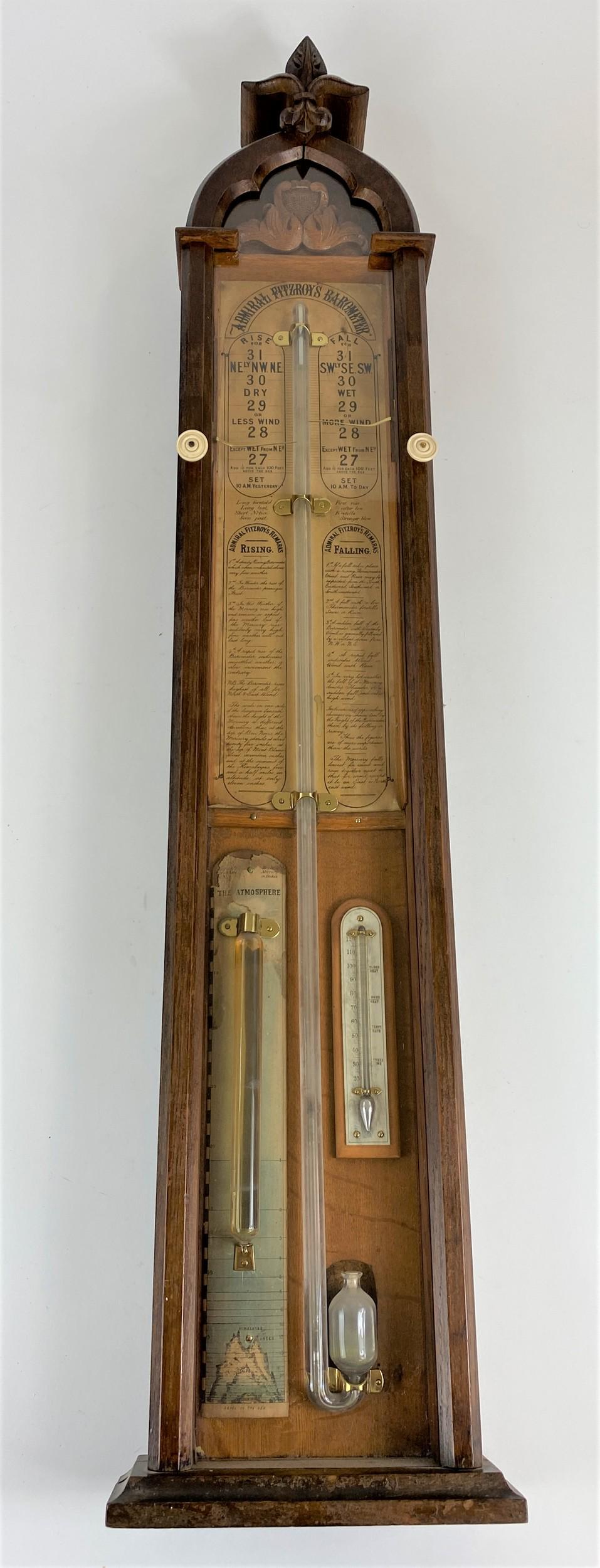 Admiral Fitzroy Barometer: A 19th century wood cased complicated barometer, "Admiral Fitzroy's Barometer", with three levels for seasonal, temperature and atmospheric, the interior outfitted with paper labels describing the pro