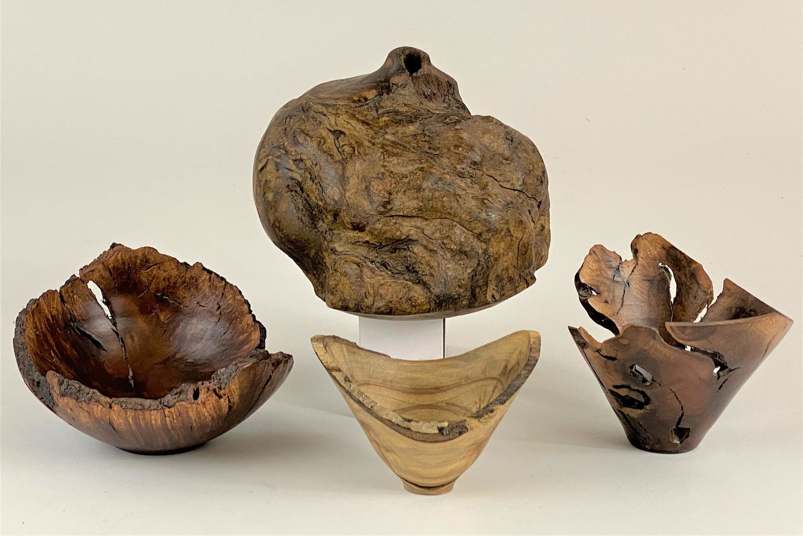 Rude Osolnik (1915-2001) Collection of Four Smaller: Grouping of four rare wood vessels and sculpture by Rude Osolnik. Largest: 5.25" ht. "Rude was widely admired as one of the finest wood turners in America and his workshops and seminars were in demand