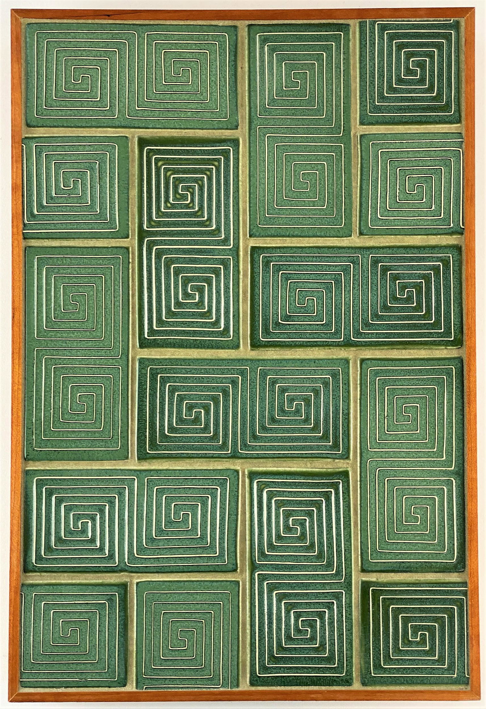 Contemporary Rookwood Pottery Framed Geometric Tile: A contemporary Rookwood Pottery plaque, Cincinnati, OH. Consisting of green geometric tiles, housed in Arts & Crafts style frame; 18.5" ht. x 12.5" wd. (framed).